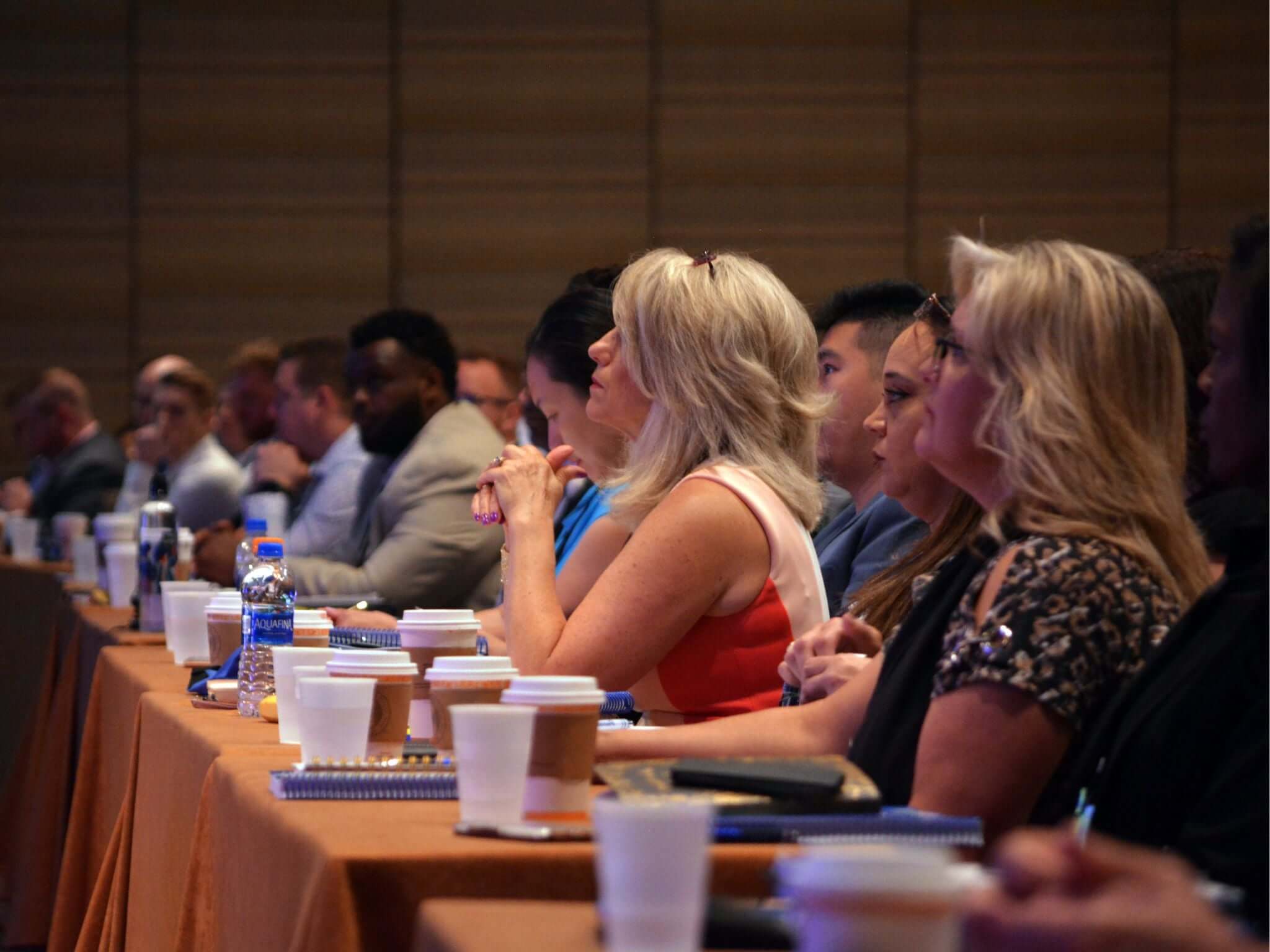 Conference attendees watching speaker in session