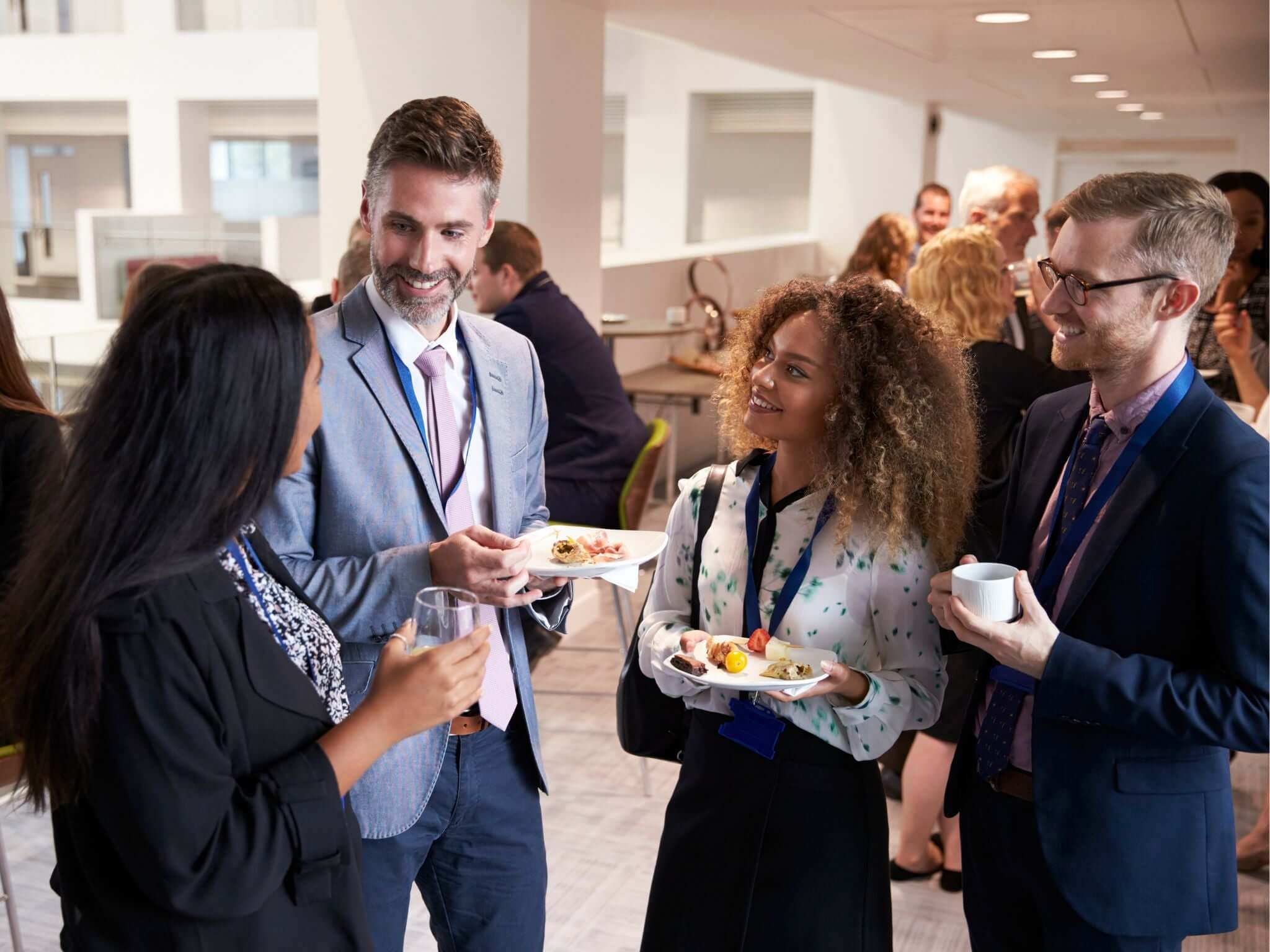 Conference guests talking during lunch break