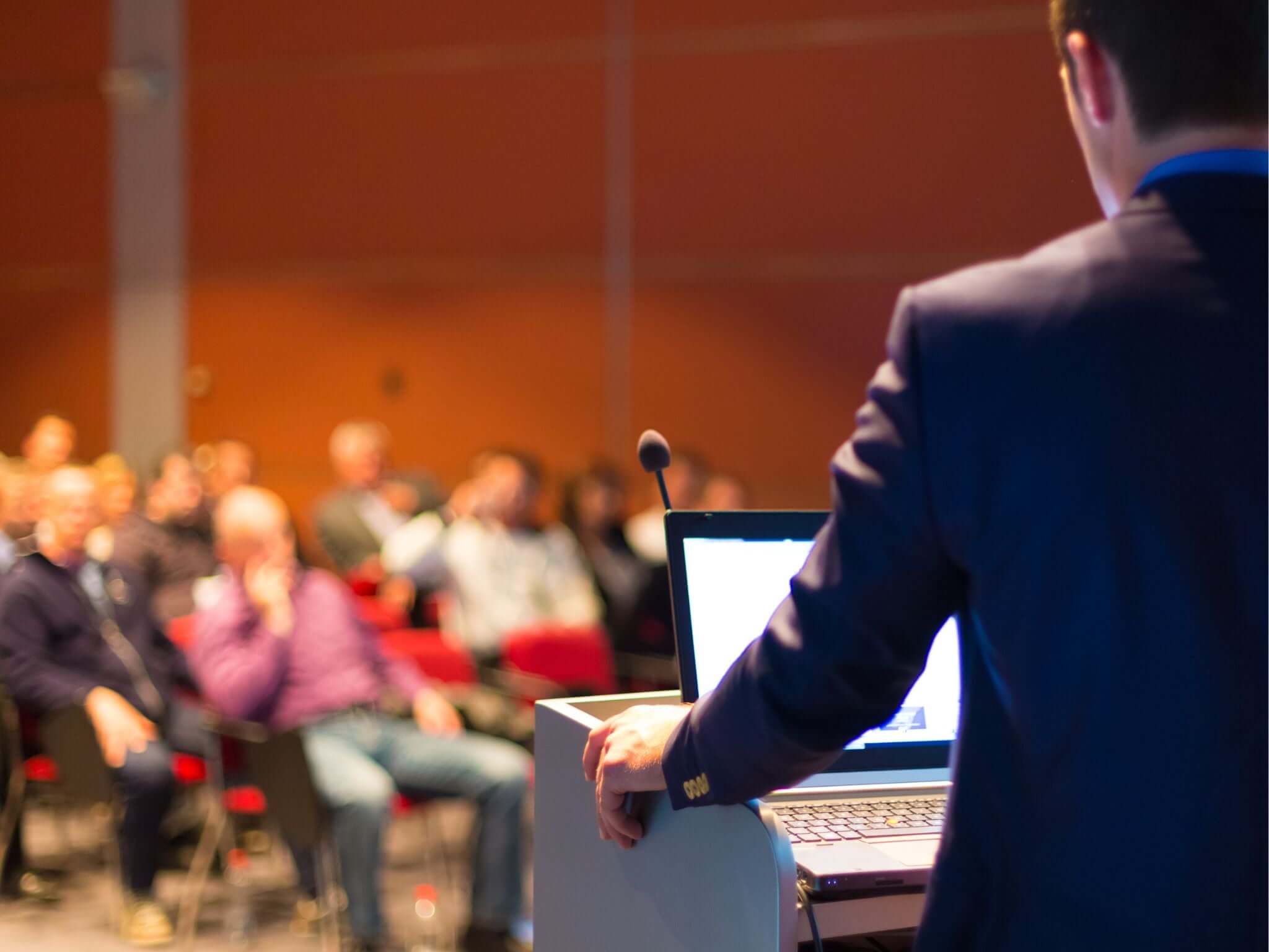 Conference speaker talking to audience