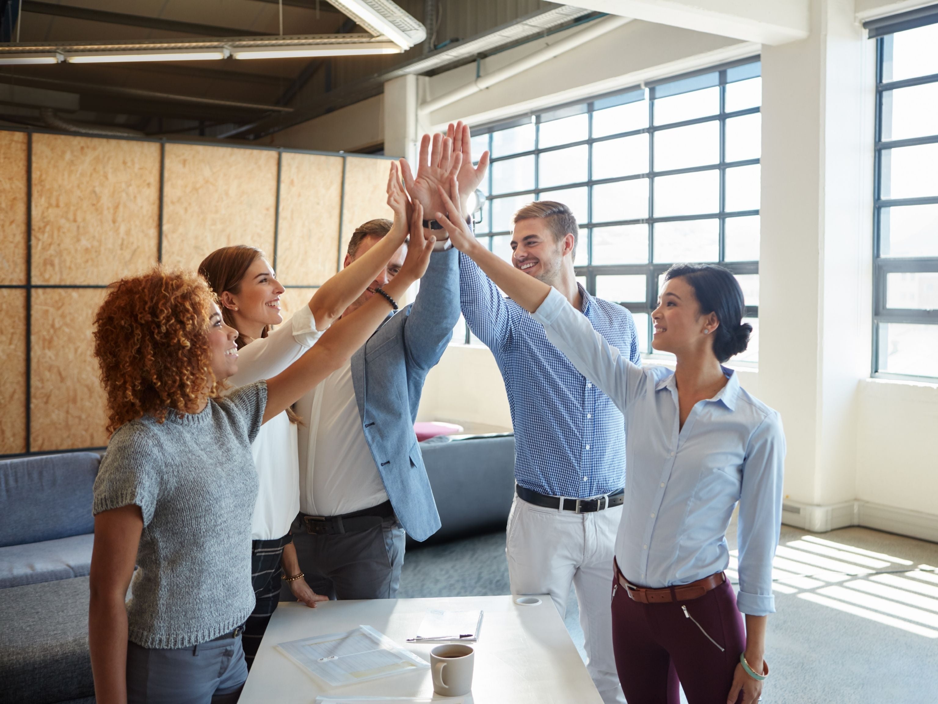Staff giving each other hi fives