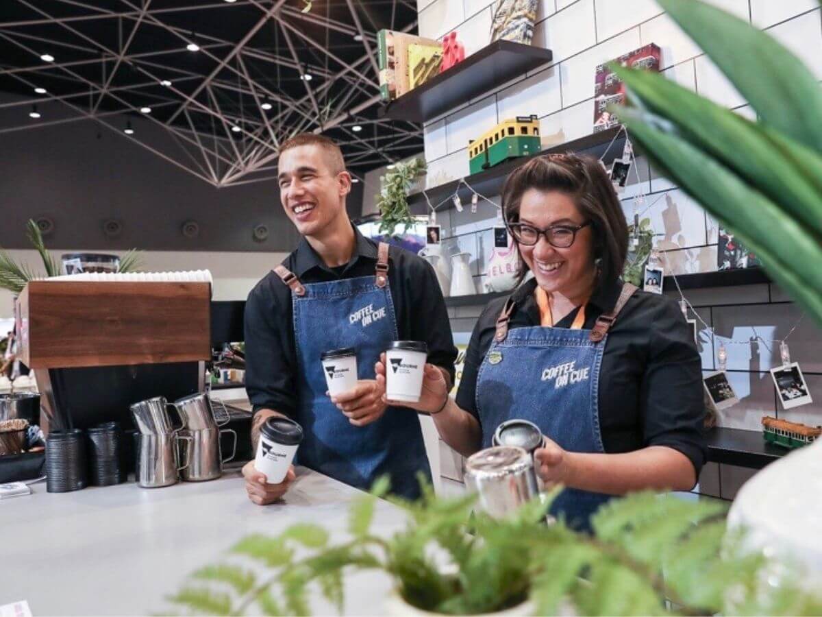 Baristas posing for camera at tradeshow