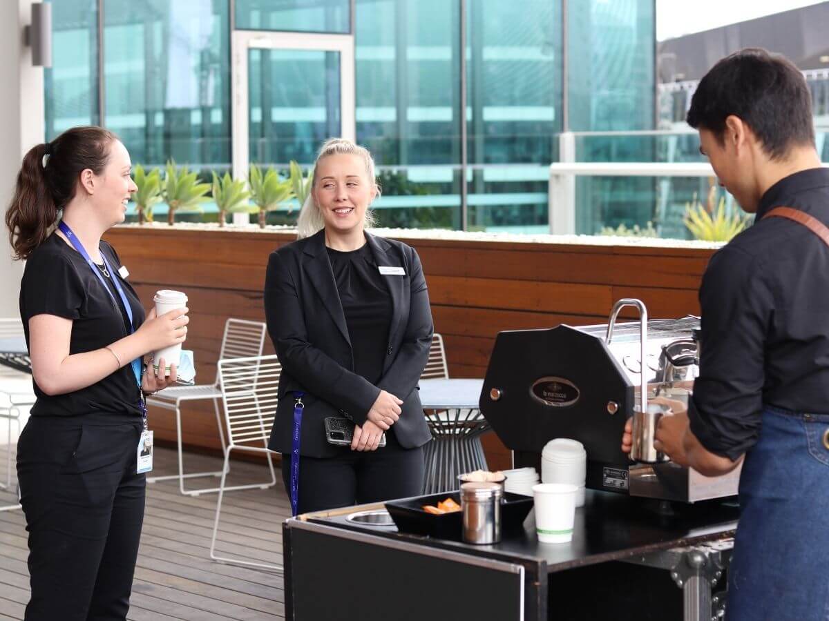 Corporate staff waiting at the coffee cart