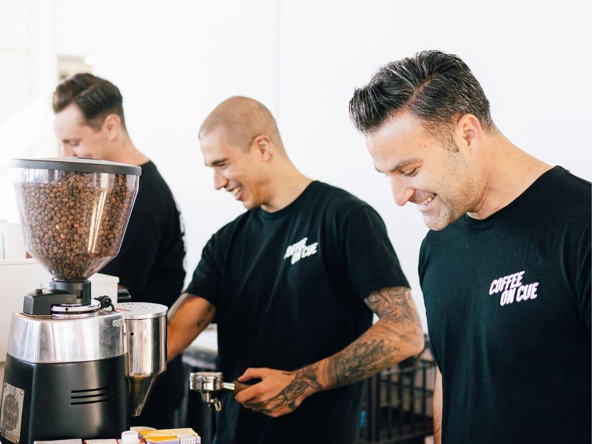 Baristas preparing coffee at market event