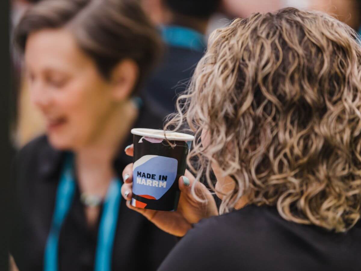 Event attendee drinking their coffee