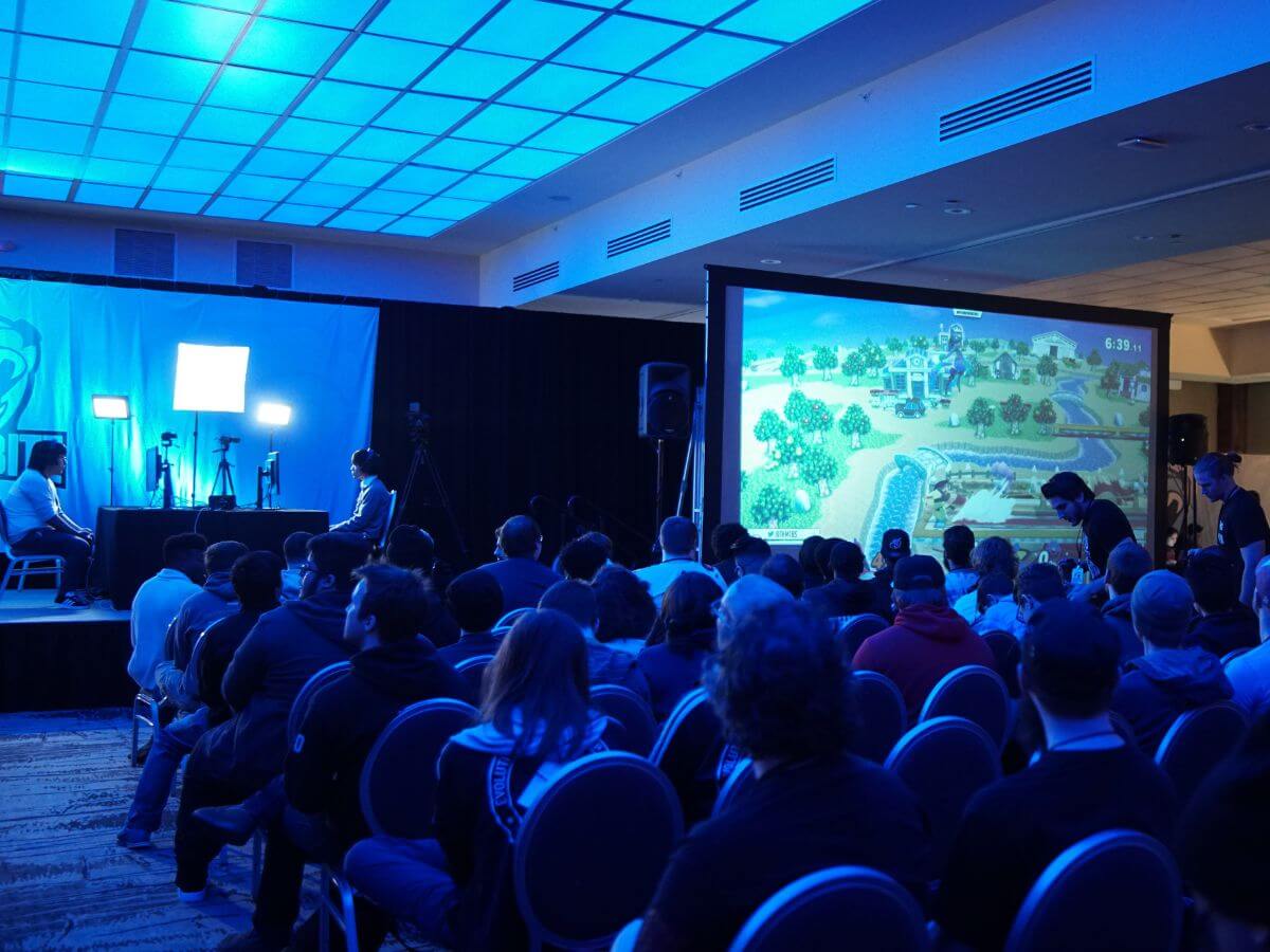 Attendees watching a projected presentation on screen