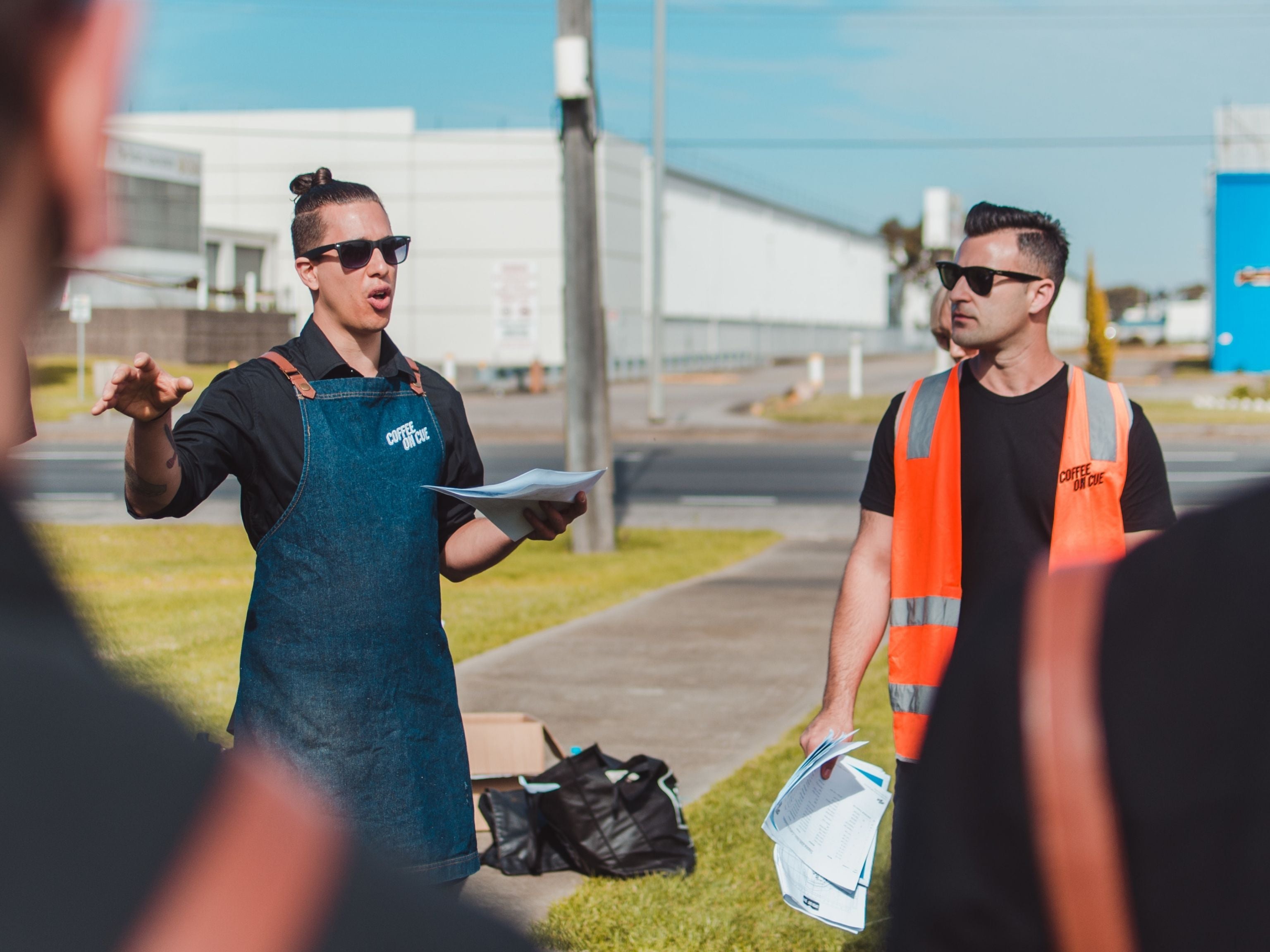 Managers giving barista briefing