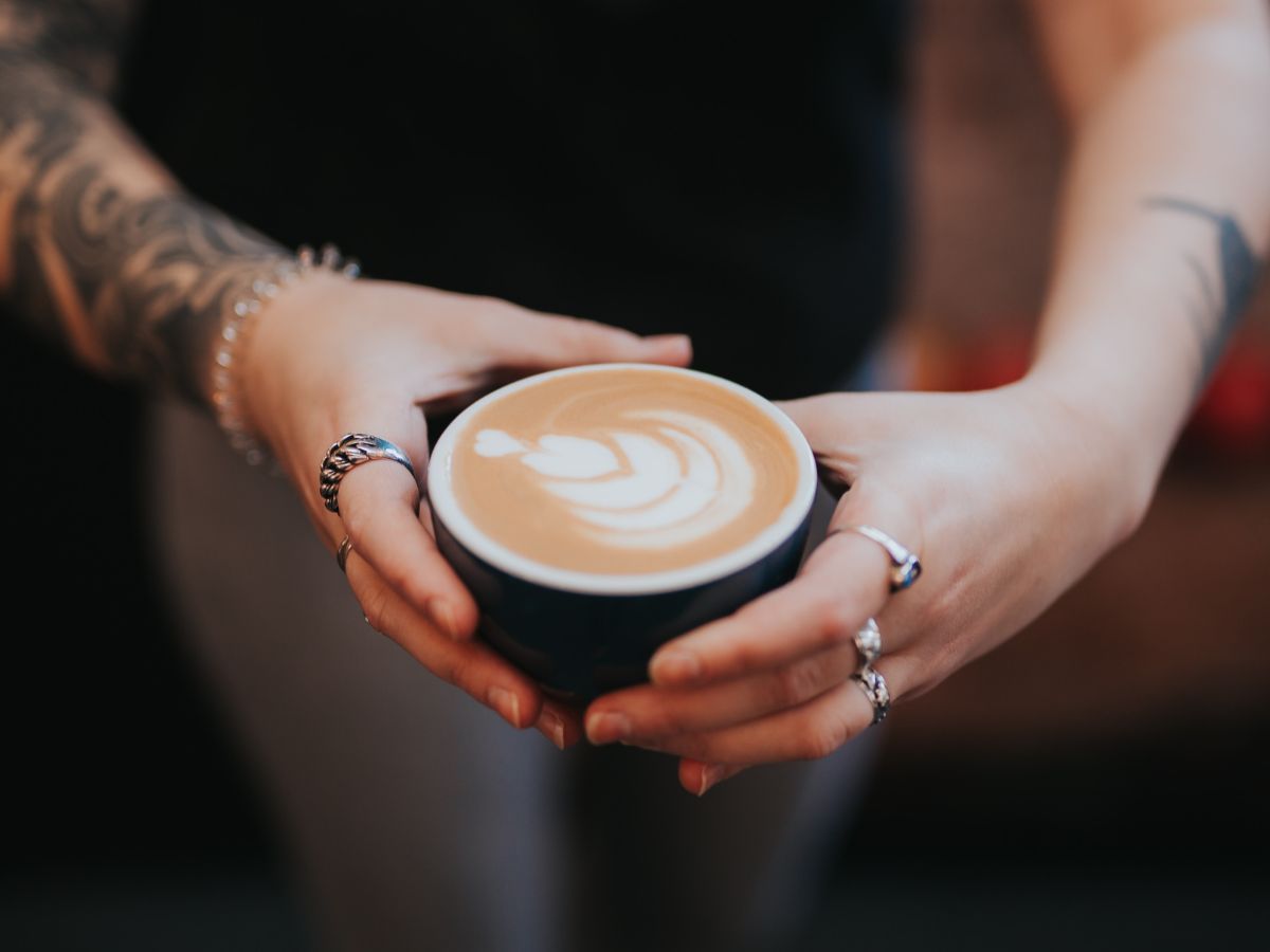 Hands holding coffee drink