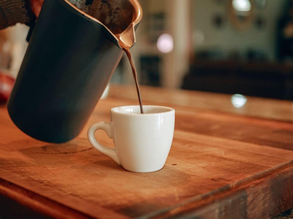 Plunger coffee being poured into cup