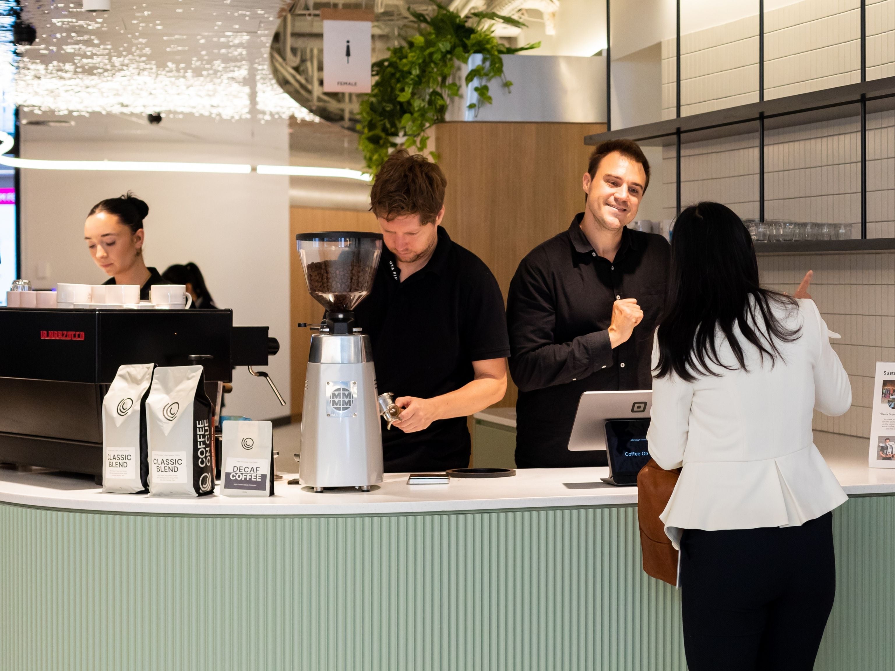 Workplace Toyota employee ordering coffee at the barista bar