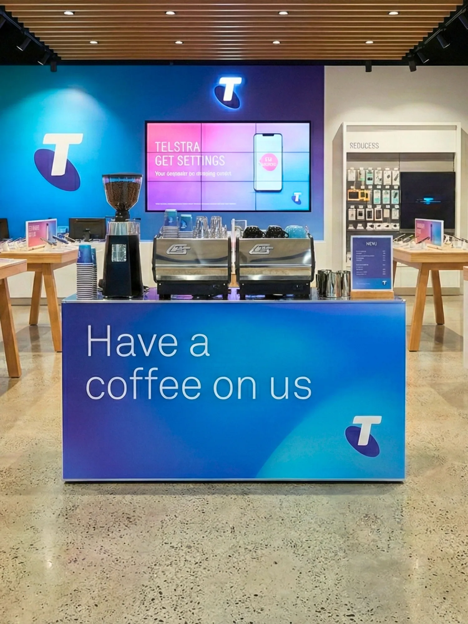 A brightly lit Coffee on Cue cart branded for a corporate client, fully set up with the machine, grinder and cups on it
