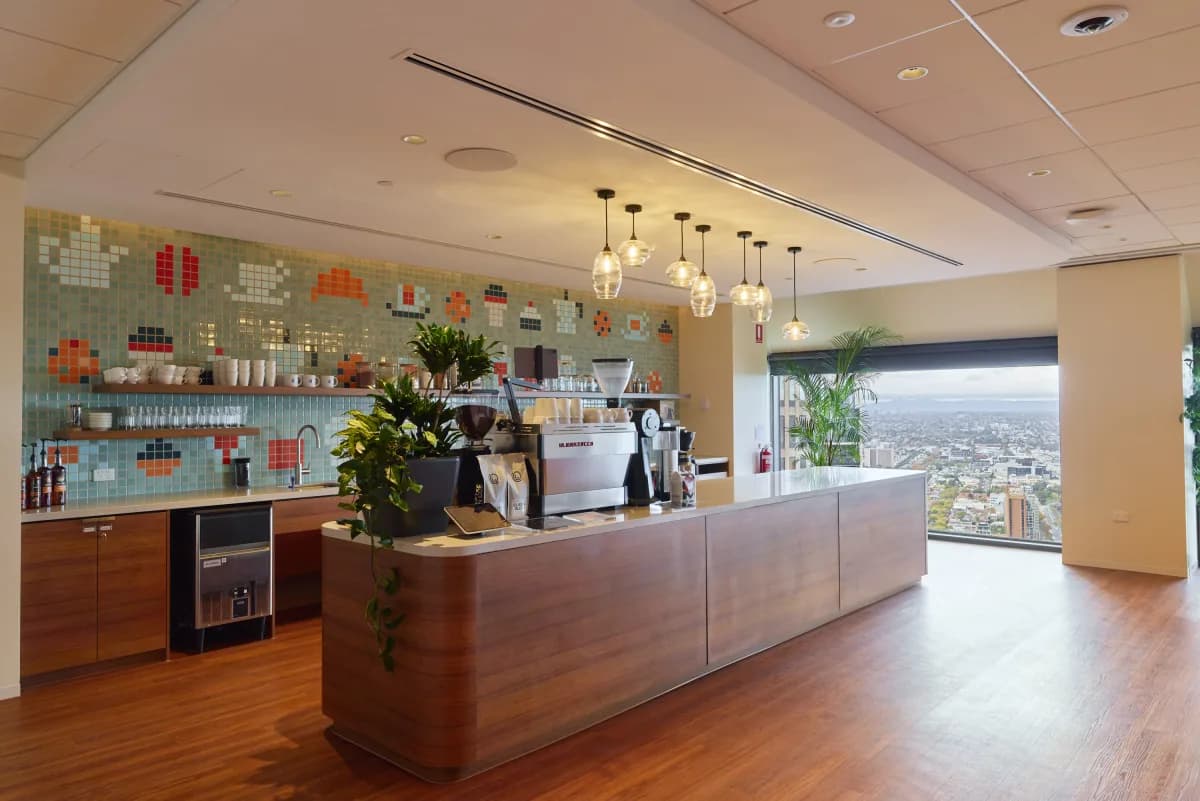 A corporate office bar in Melbourne, with the city window beyond