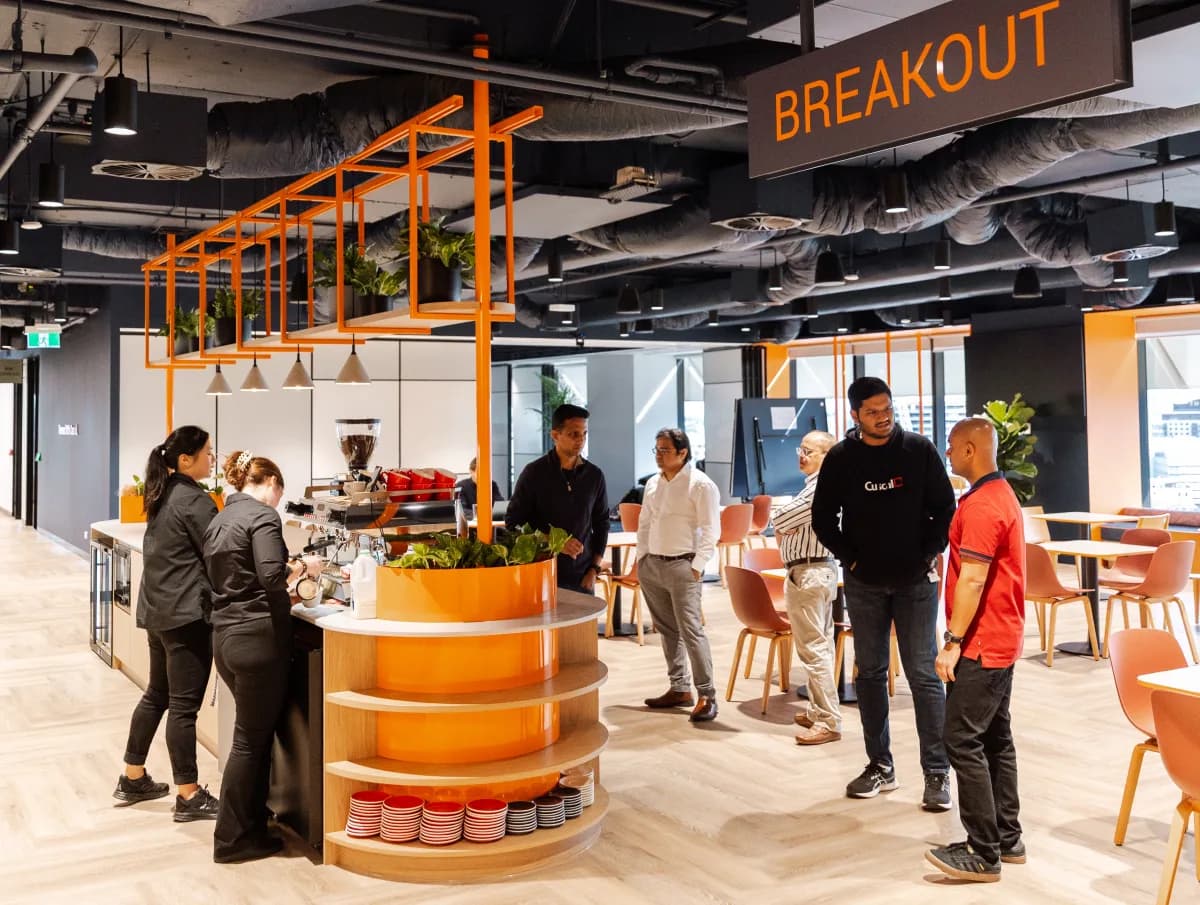The Cuscal bar on launch day, guests through the breakout space