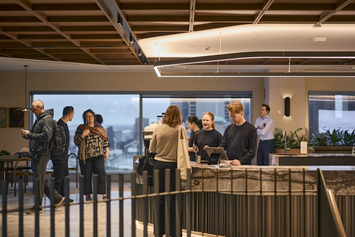 Guests along the rail at the JLL bar