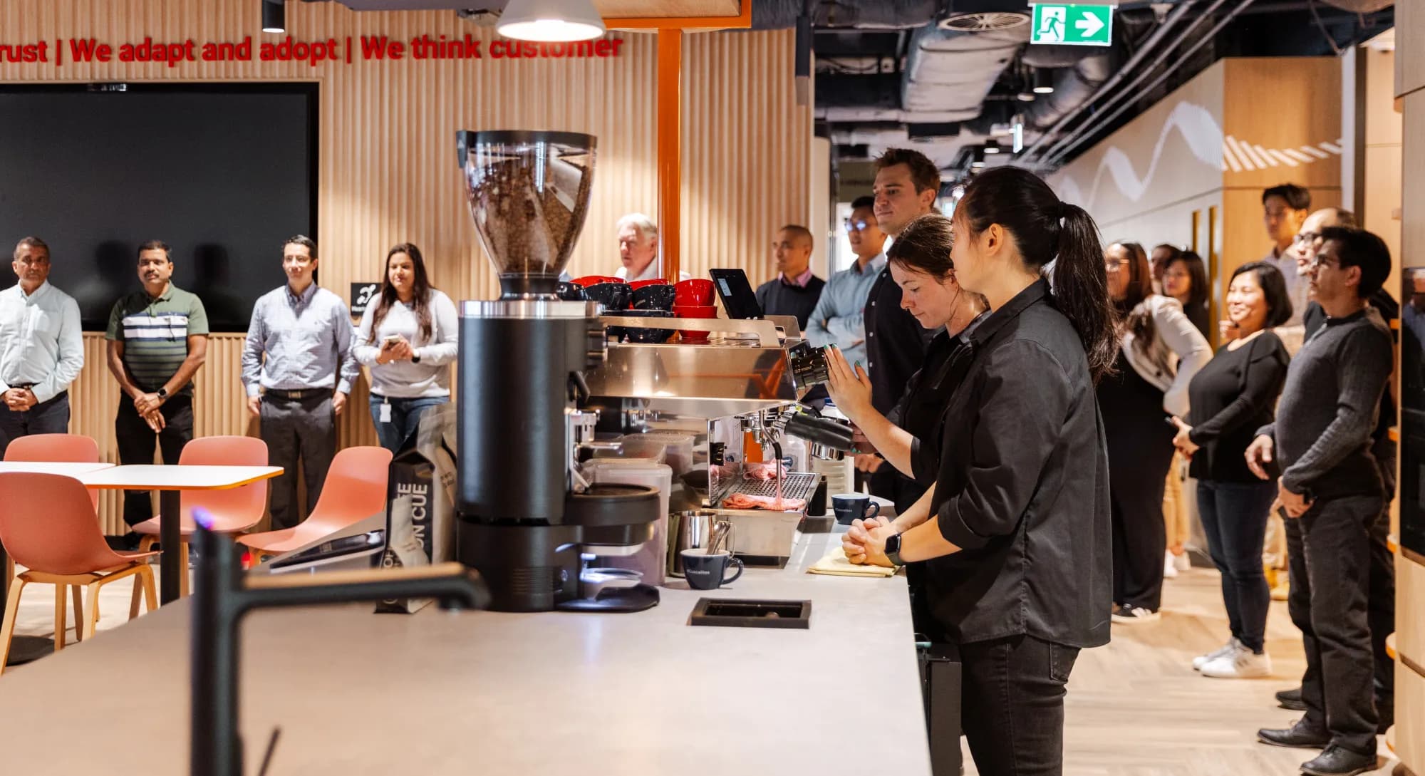 Colleagues gathered at the Cuscal Sydney bar while the crew serve