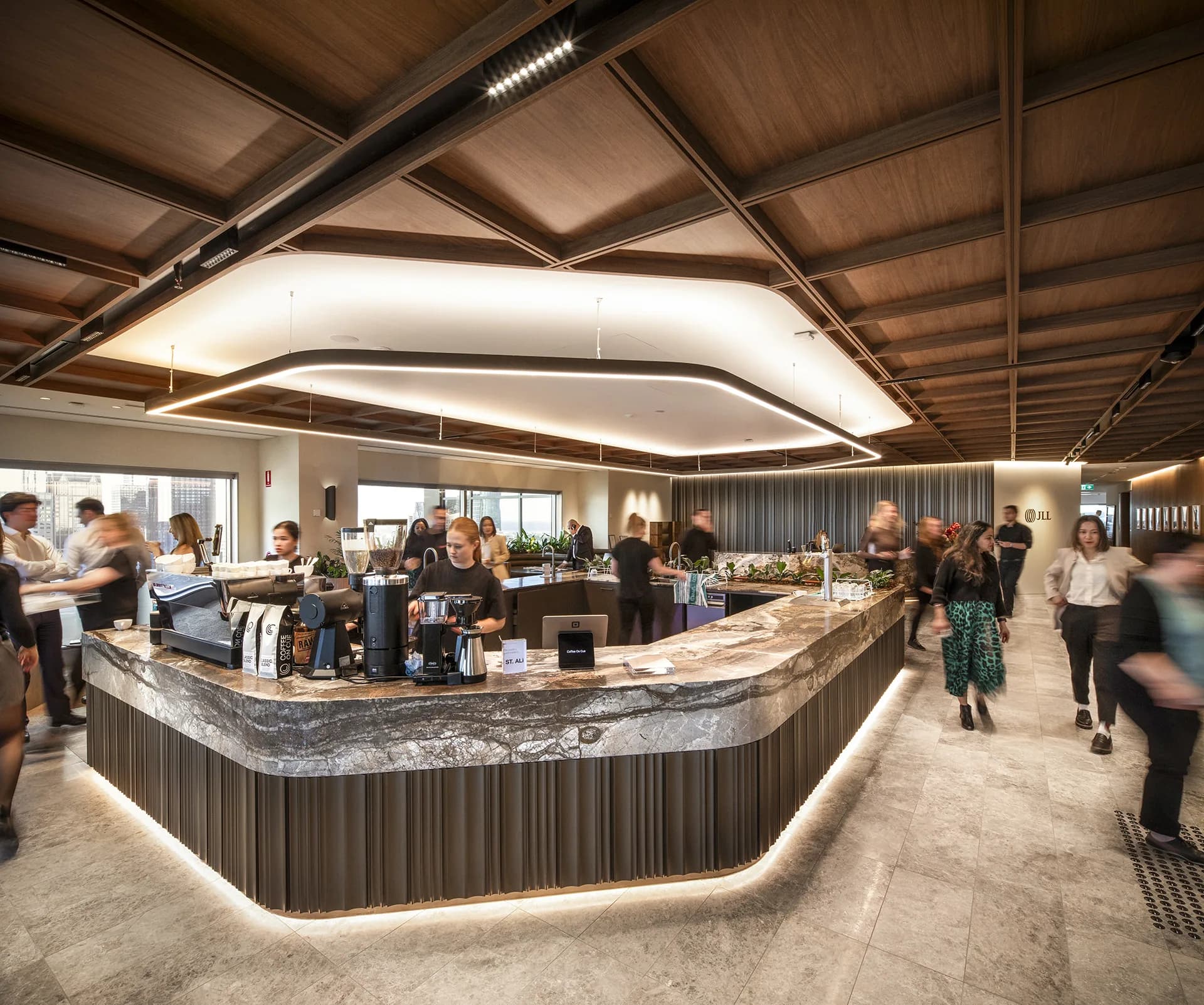 Coffee on Cue baristas serving JLL staff at the marble in-house bar at 101 Collins Street, Melbourne