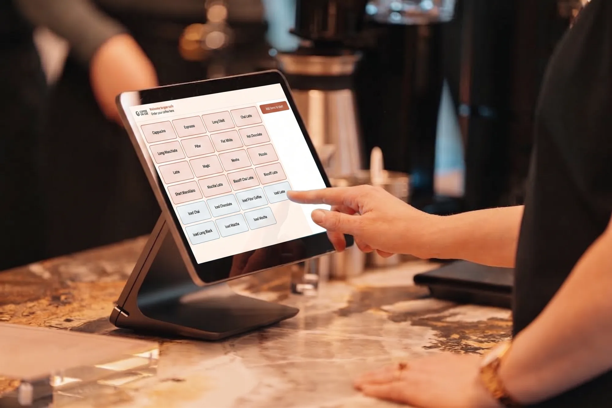 The Coffee on Cue marble espresso bar in a corporate office, cashless ordering on the counter