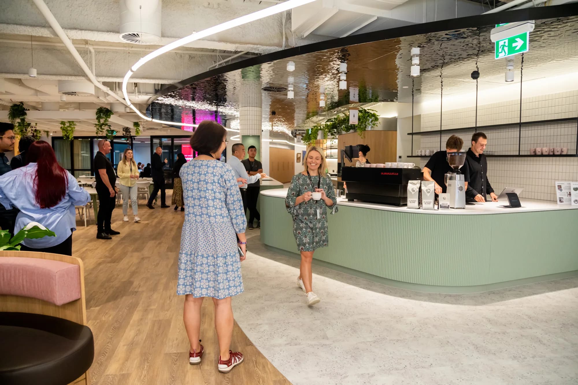 The Toyota Financial Services floor with the in-house coffee bar in it, staff moving through