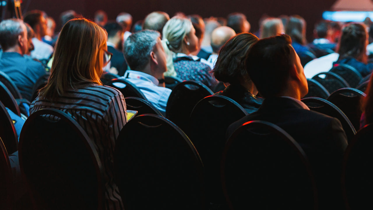 Attendees in seats at event