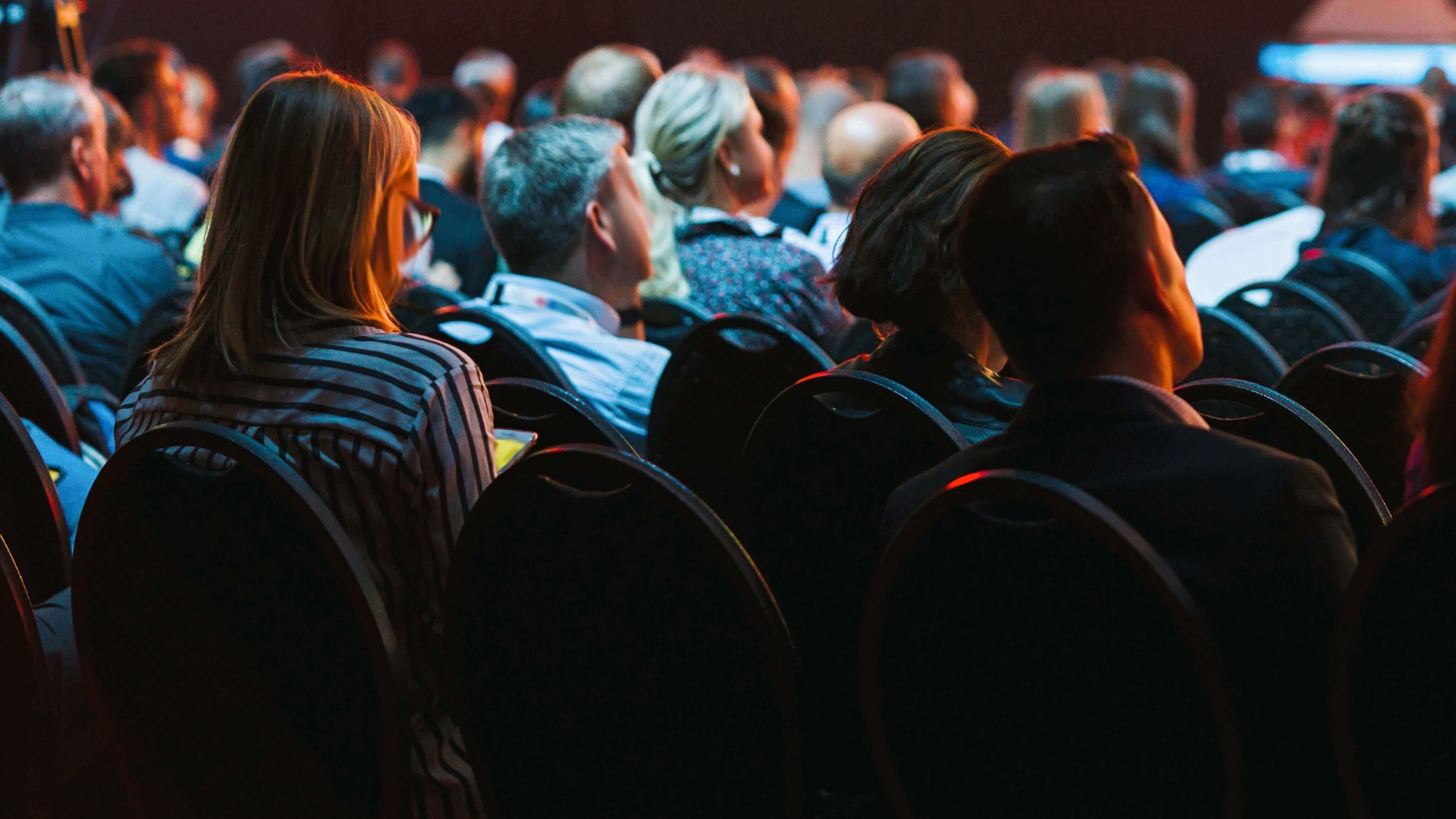 Attendees in seats at event