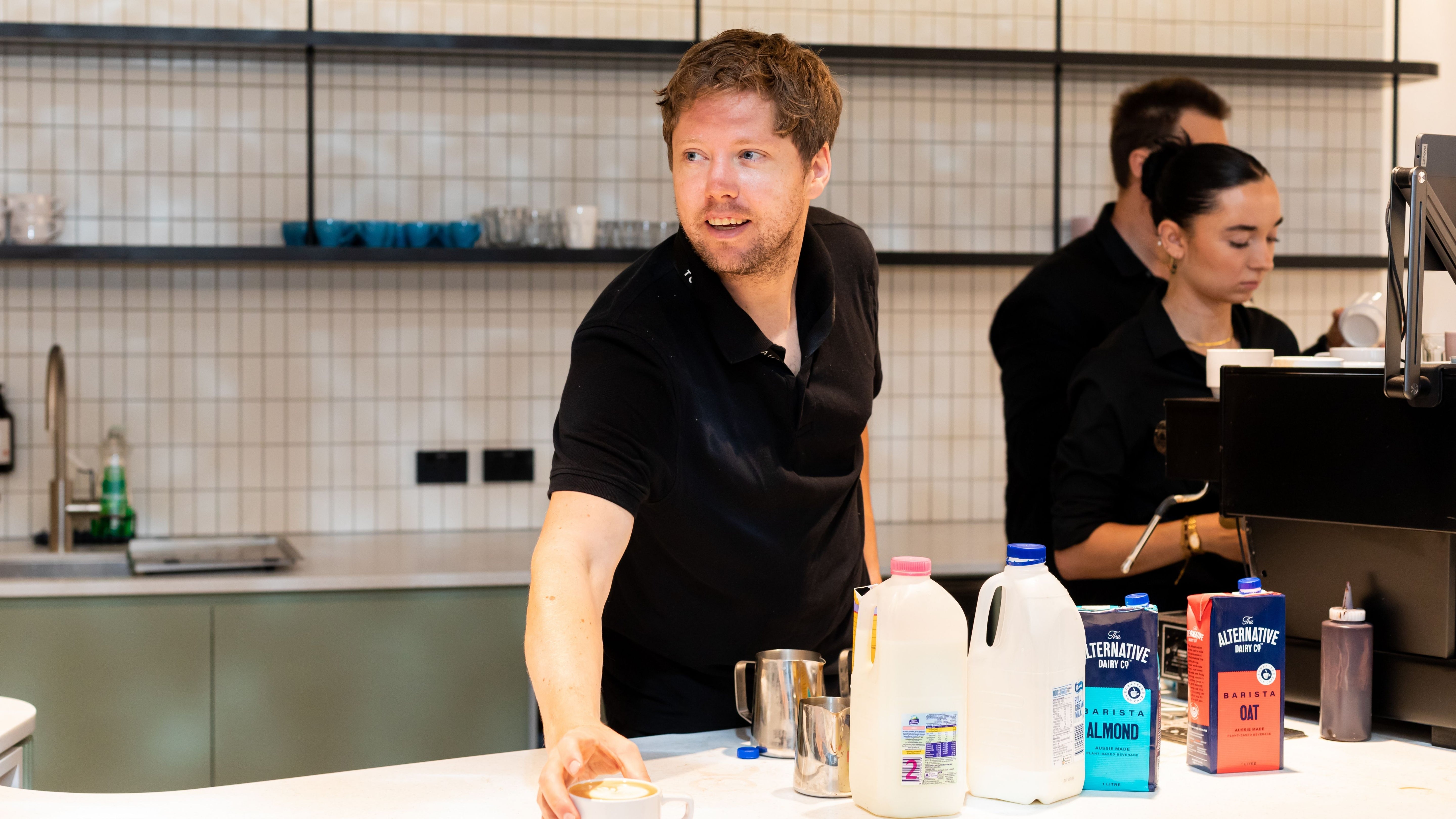 Barista serving coffee in the workplace