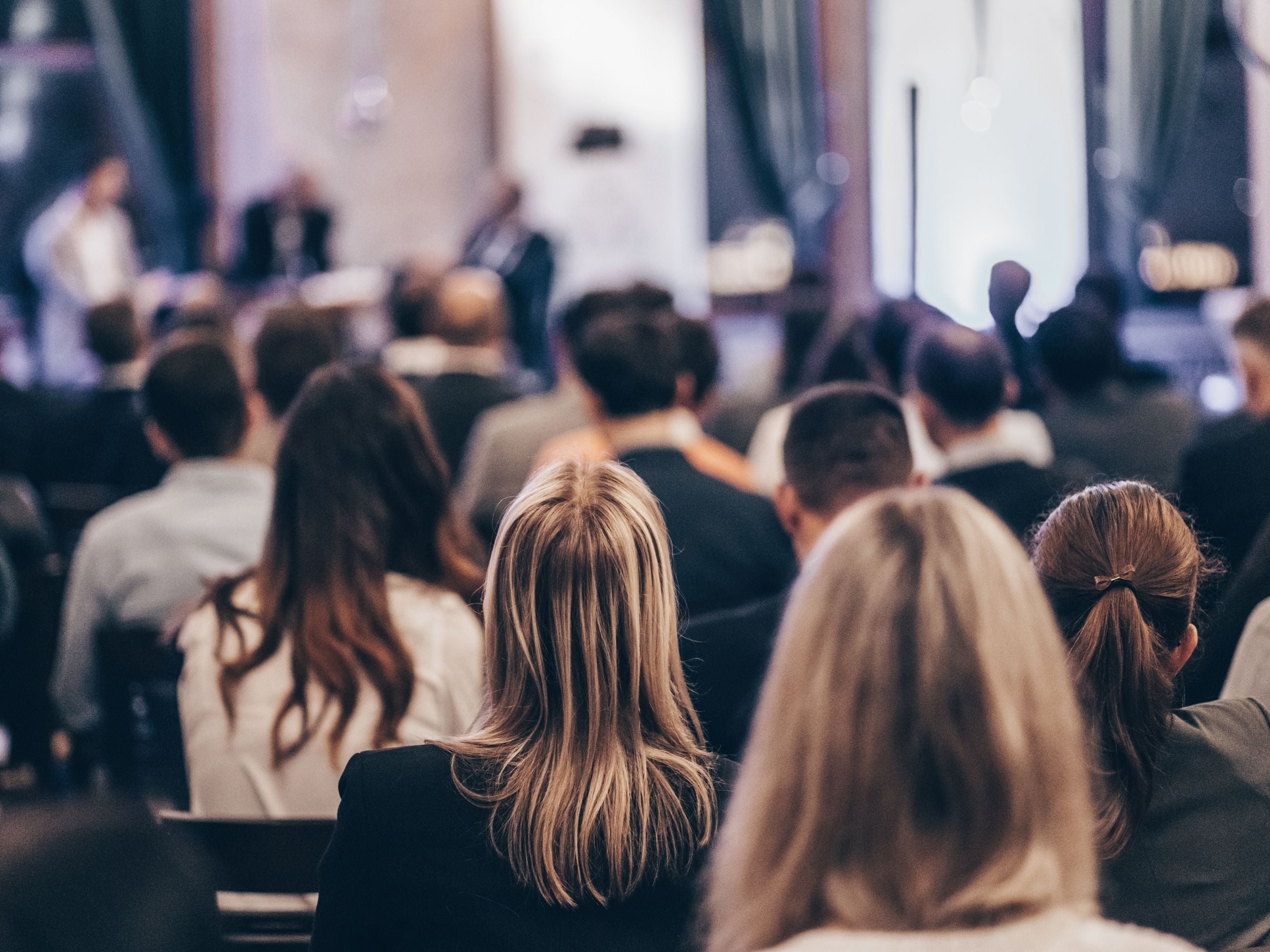 Conference attendees watching panel discussion