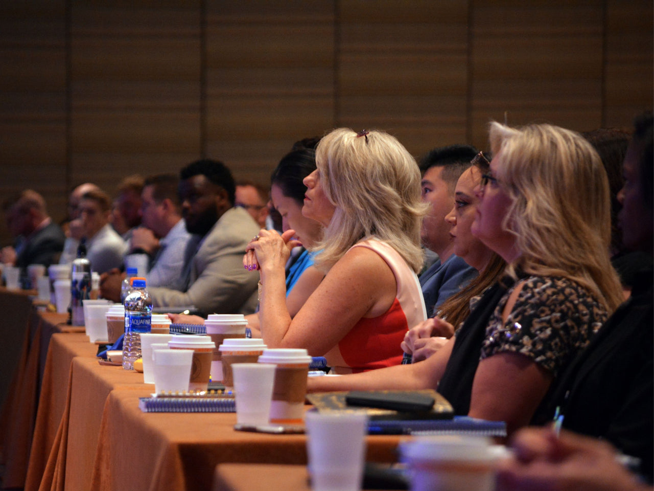 Conference attendees watching speaker in session