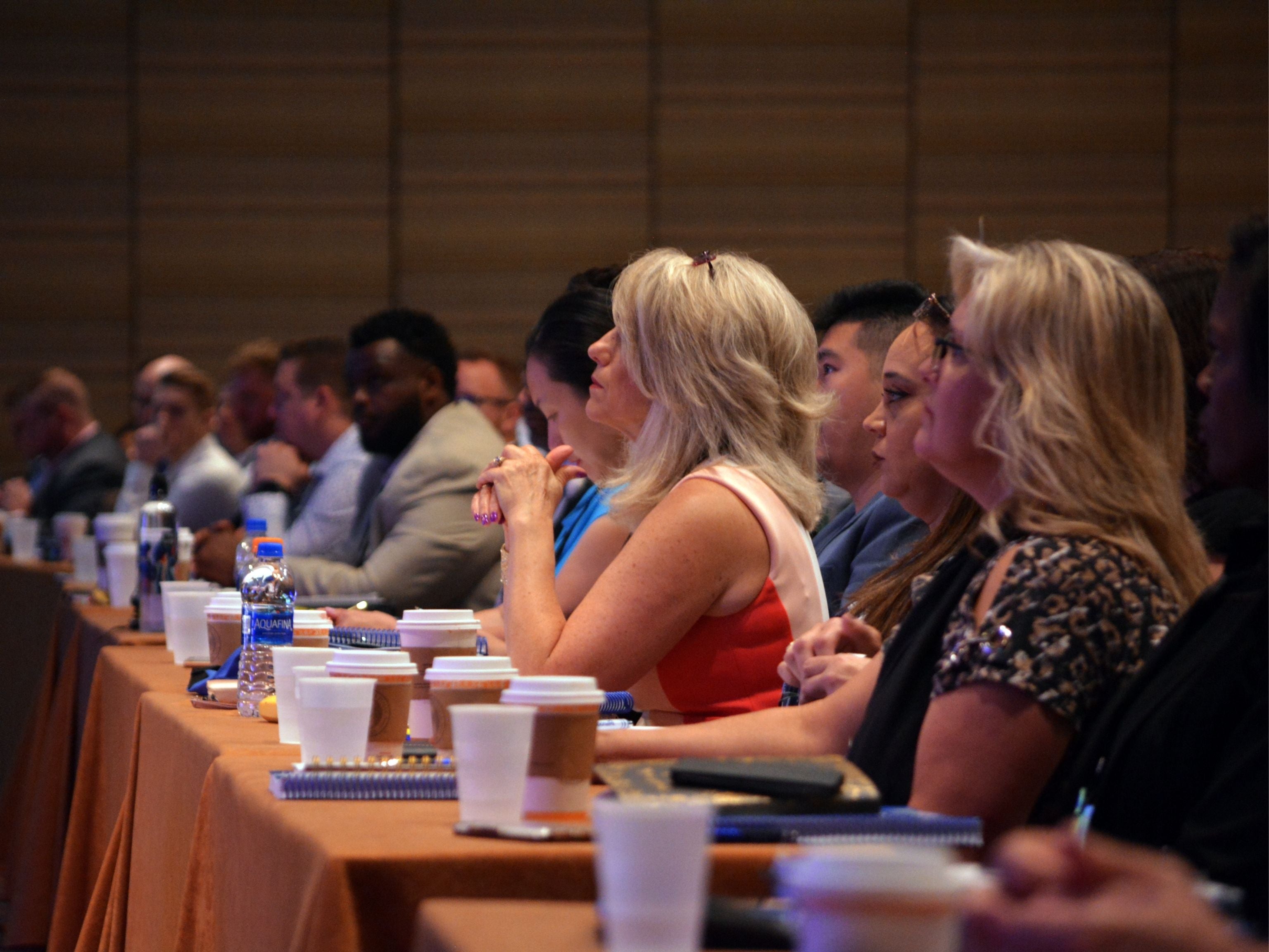 Conference attendees watching speaker in session