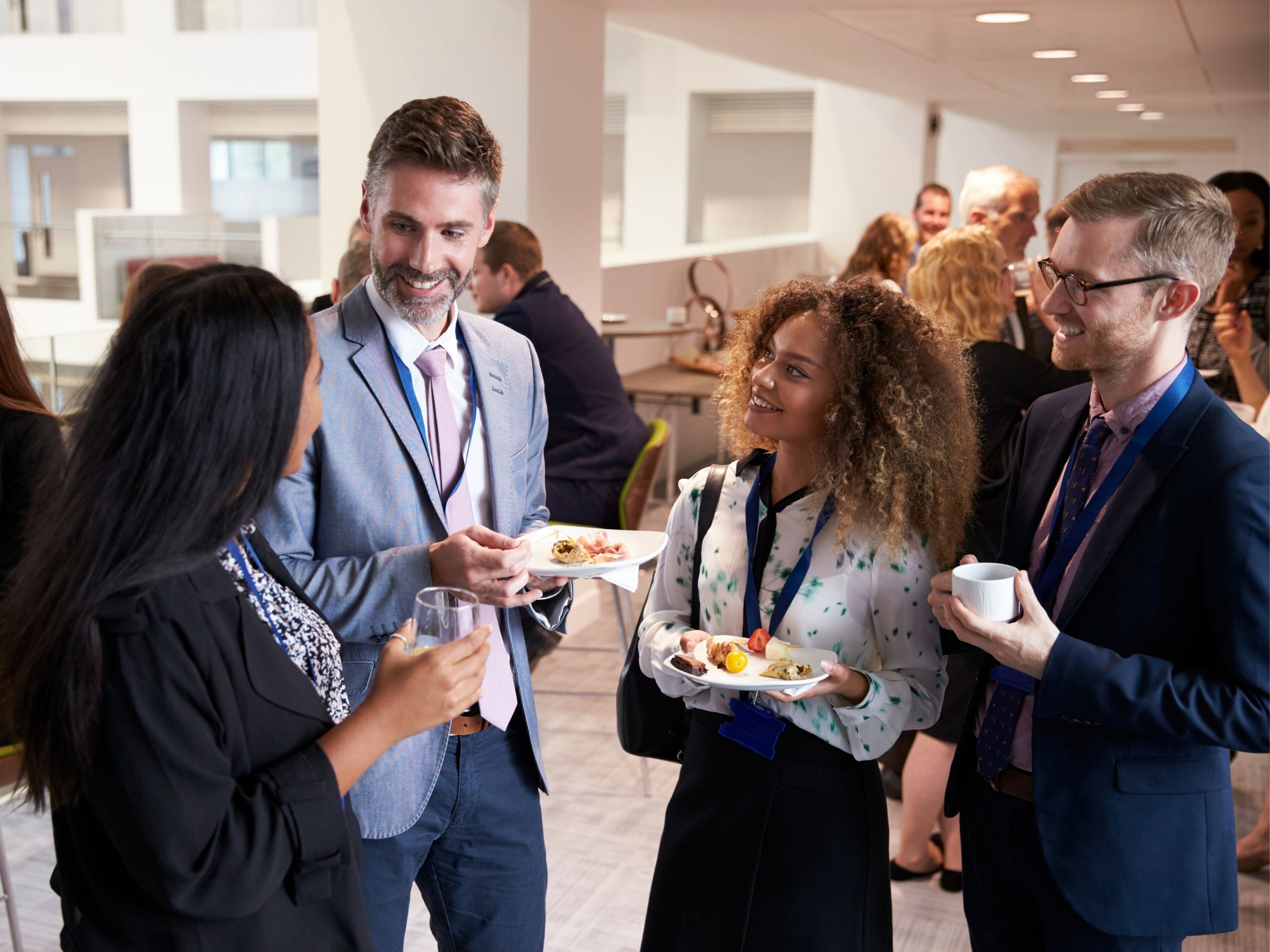 Conference guests talking during lunch break