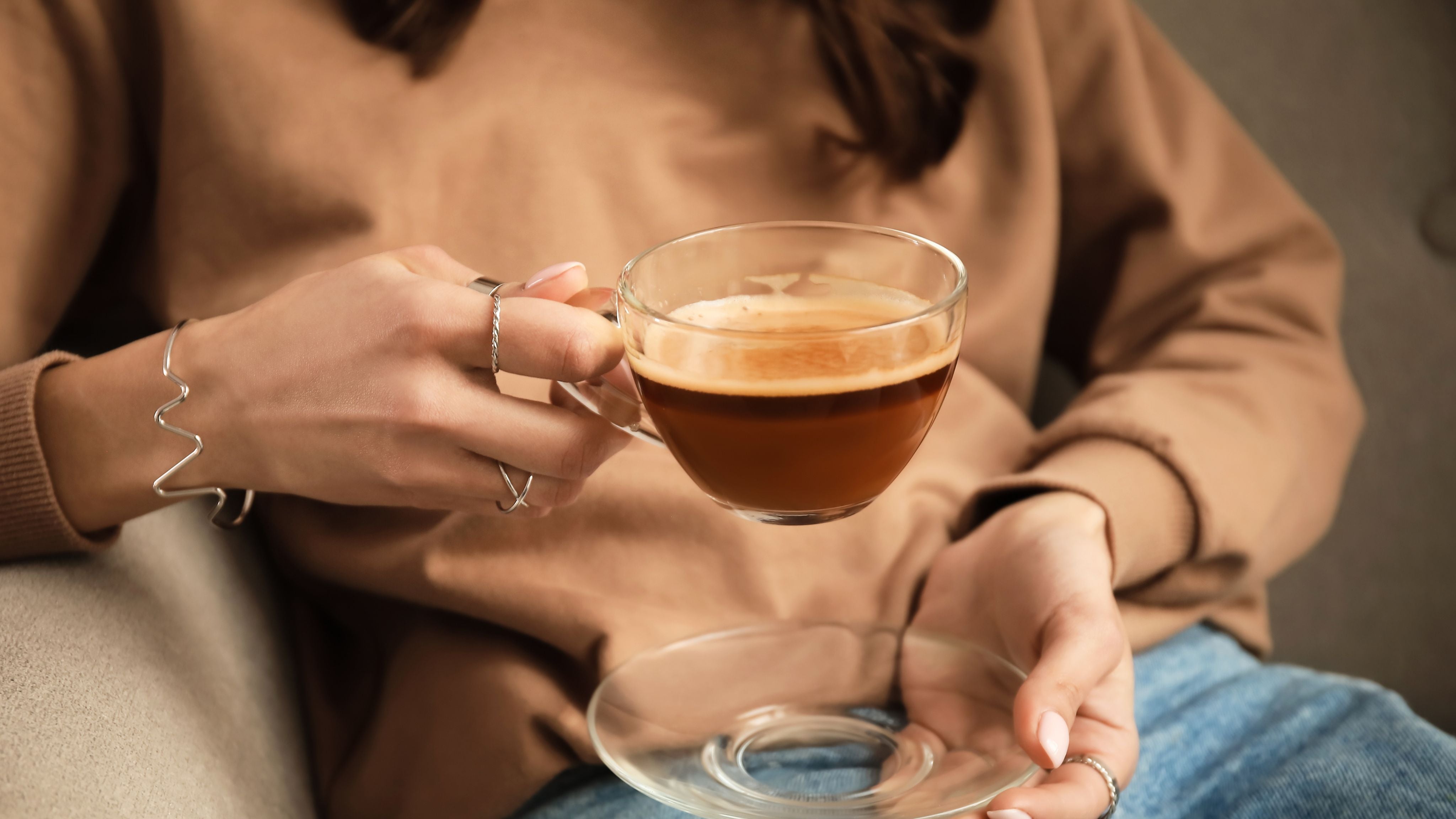 Delicious coffee in hand