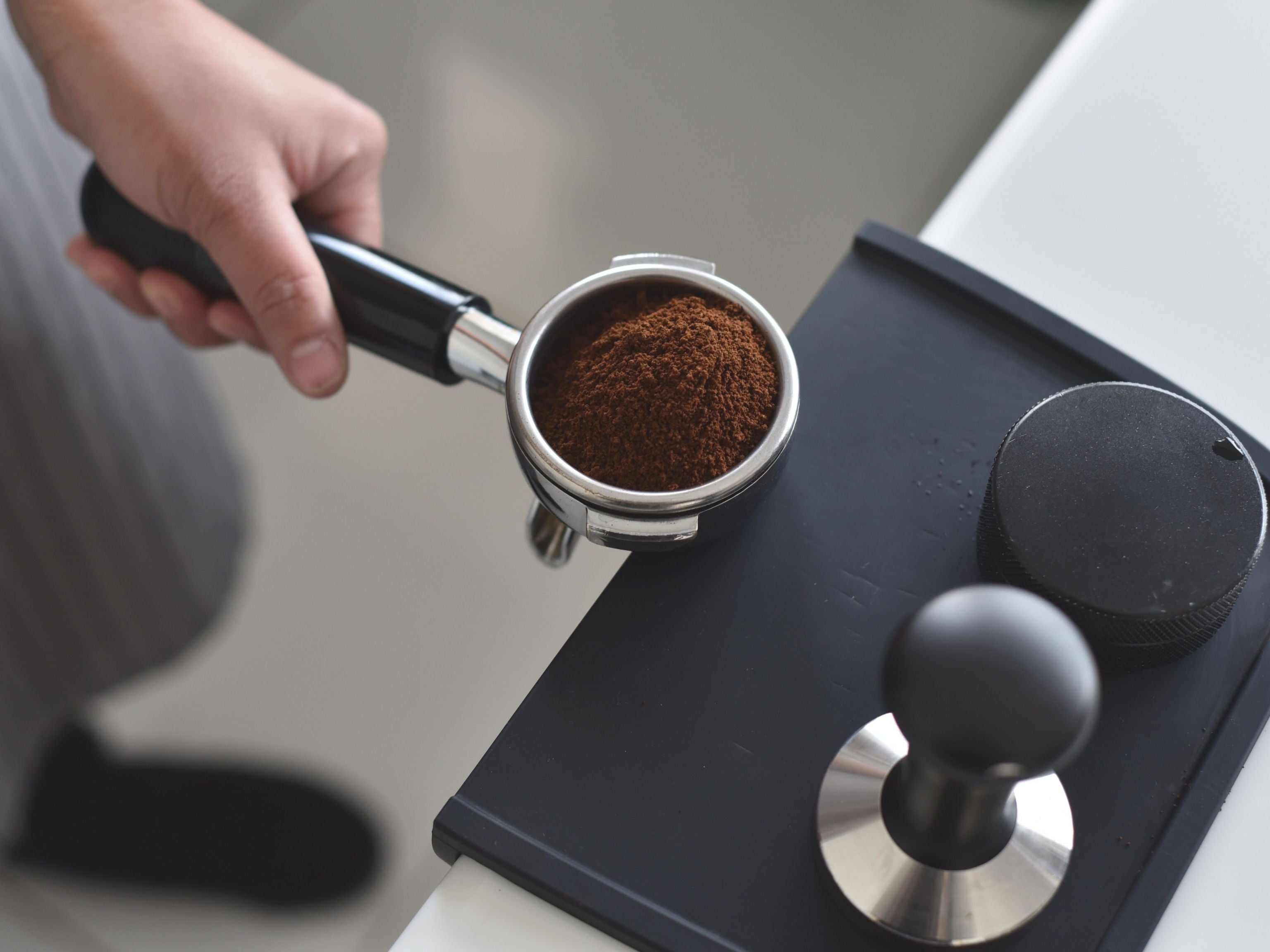 Portafilter with coffee grounds inside