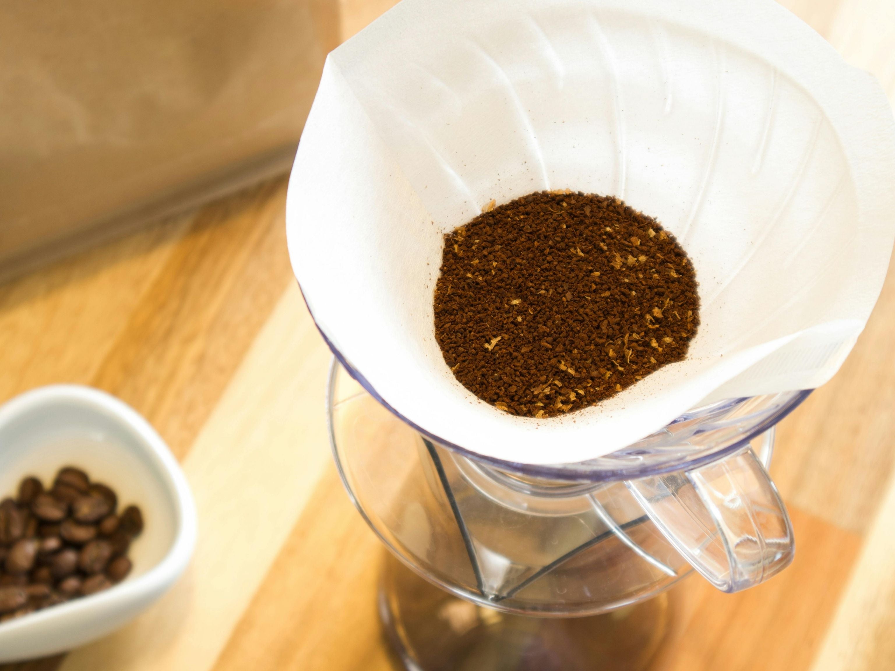 Filter paper with grounds inside
