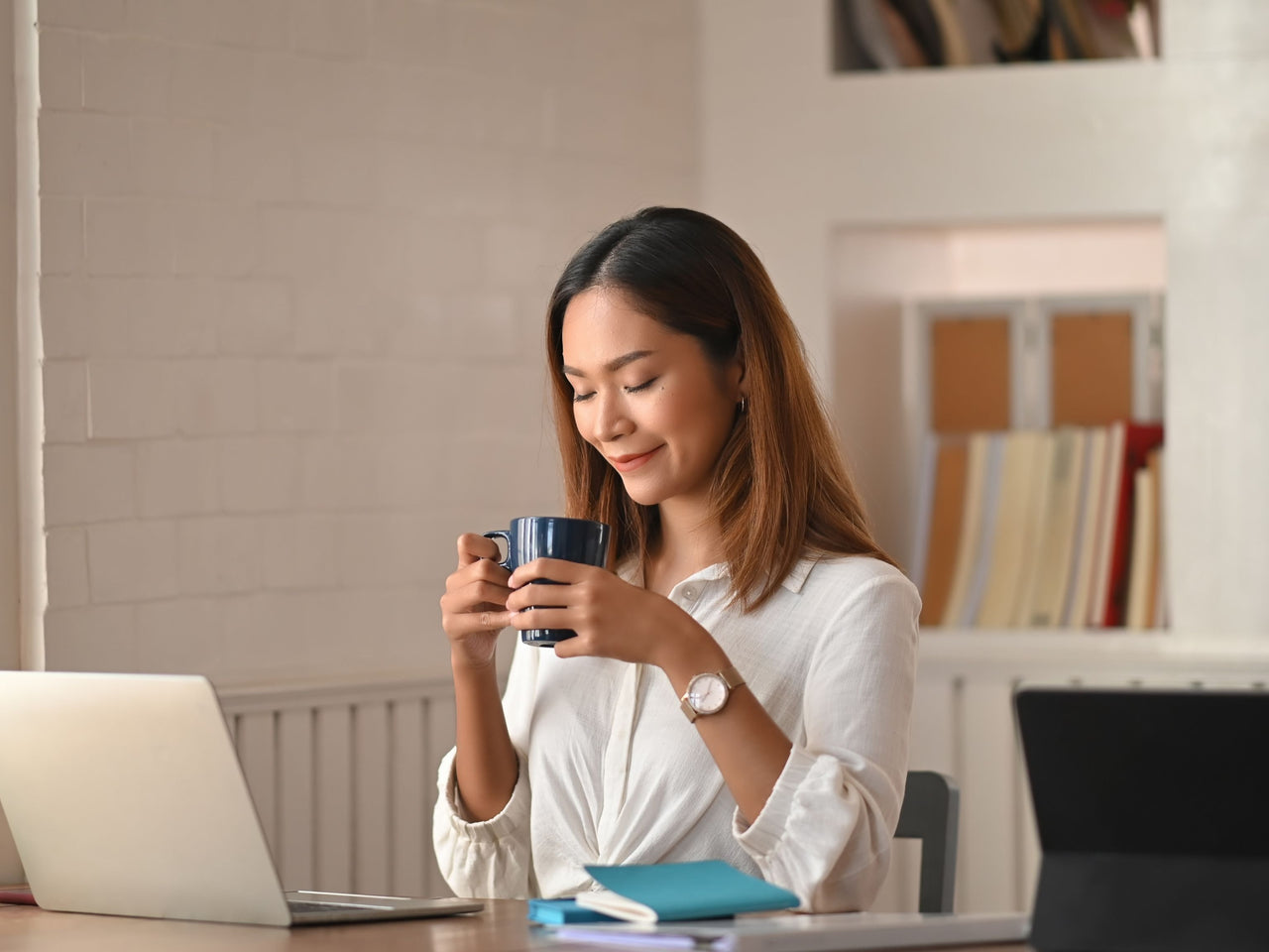 Office worker drinking coffee