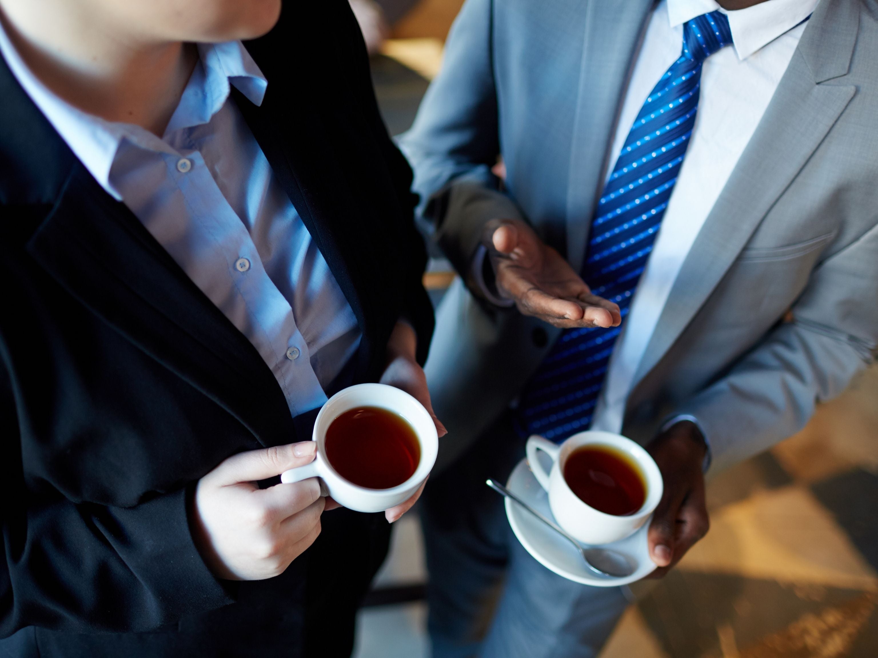Staff drinking black coffee together at work