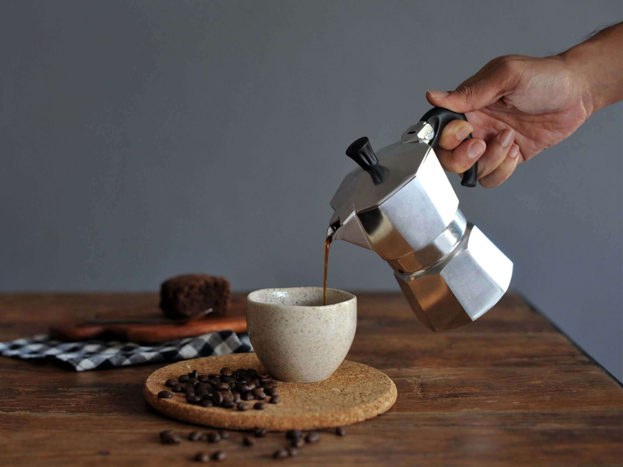 Stovetop coffee poured into ceramic cup