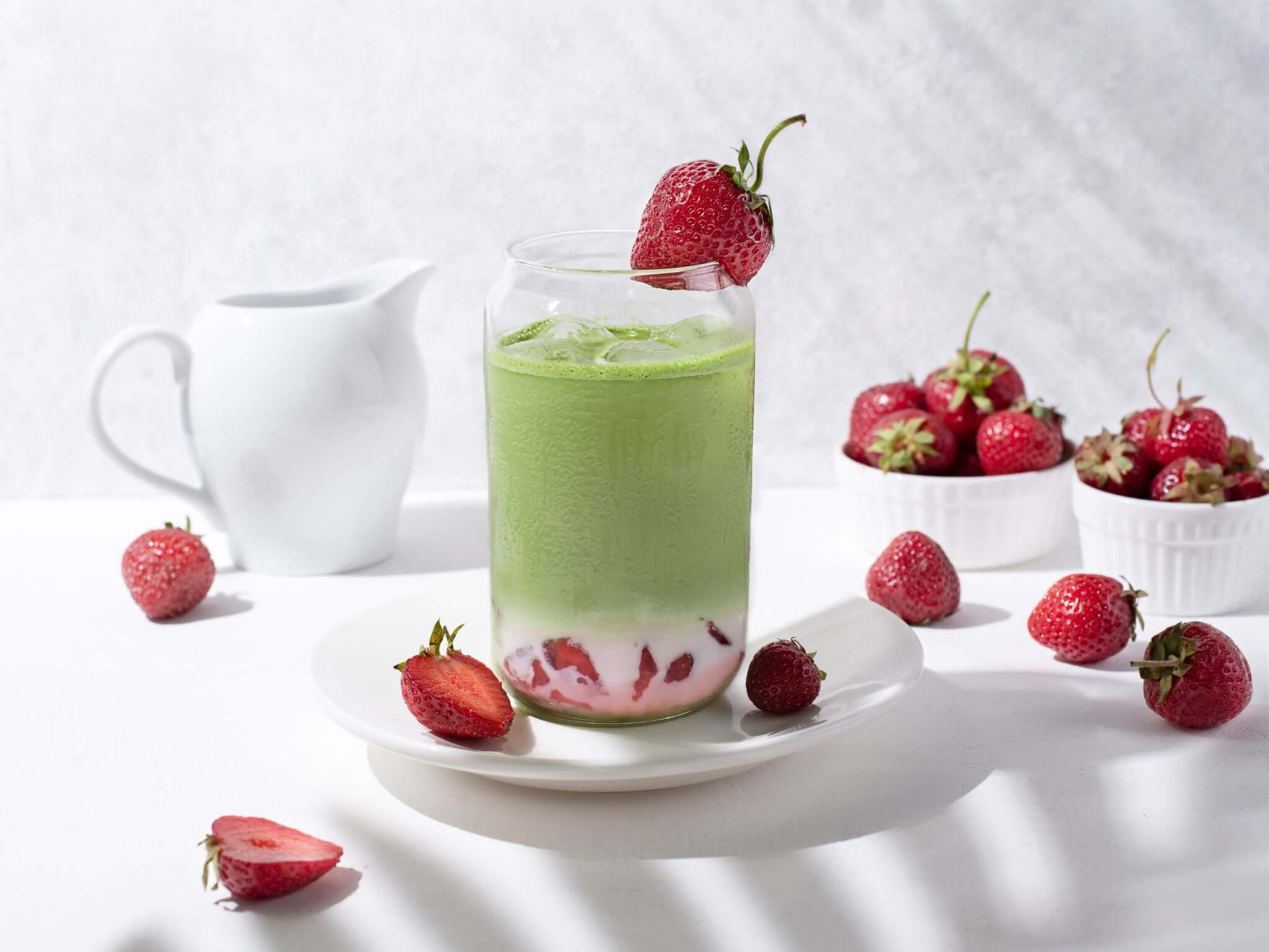 Strawberry matcha drink with berries