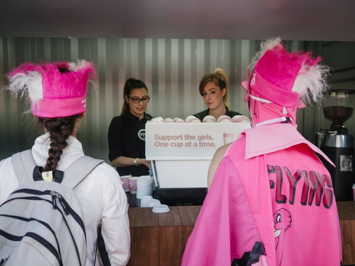 Event attendees collecting their coffees