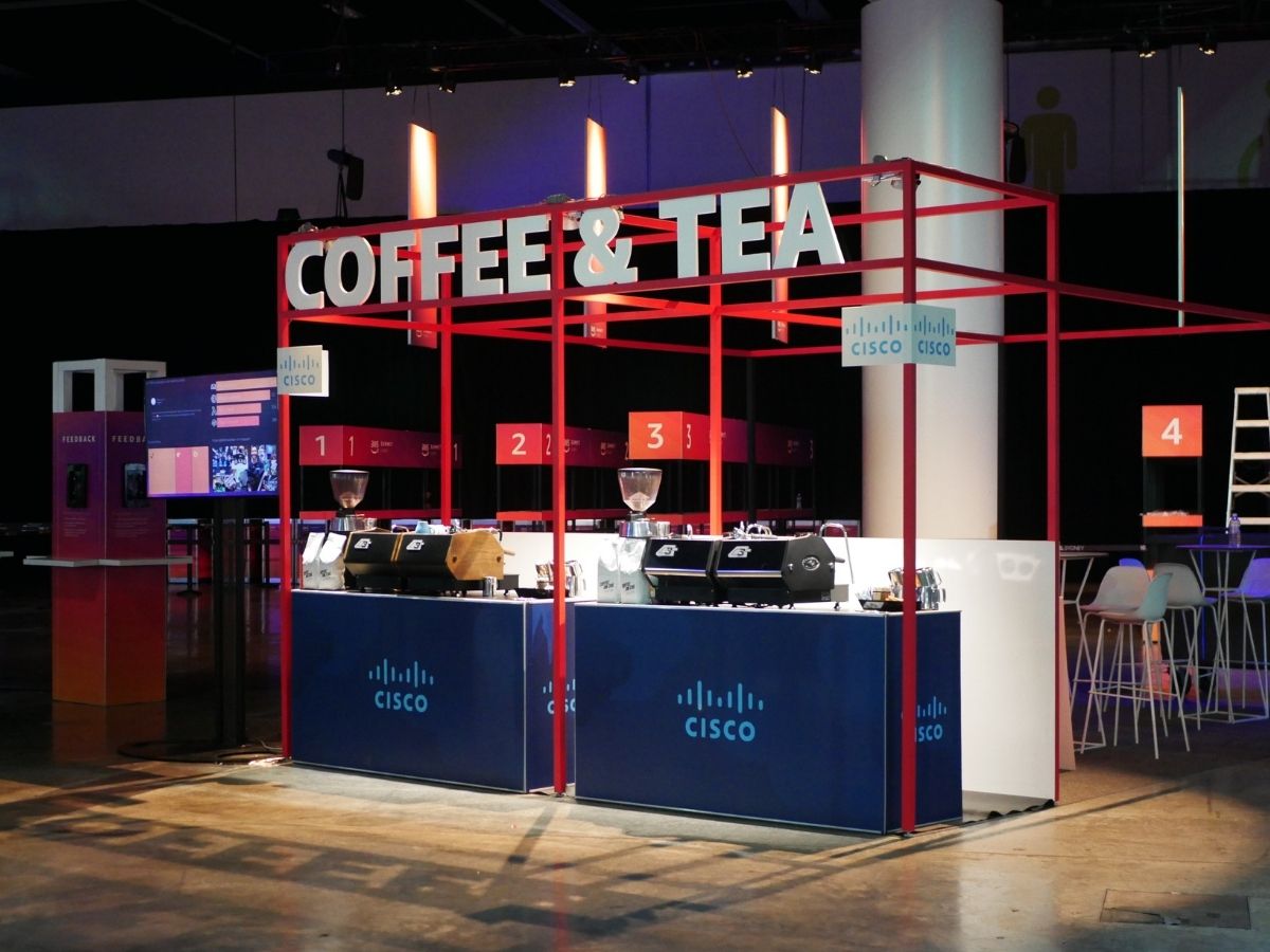 Two branded coffee carts on exhibition floor