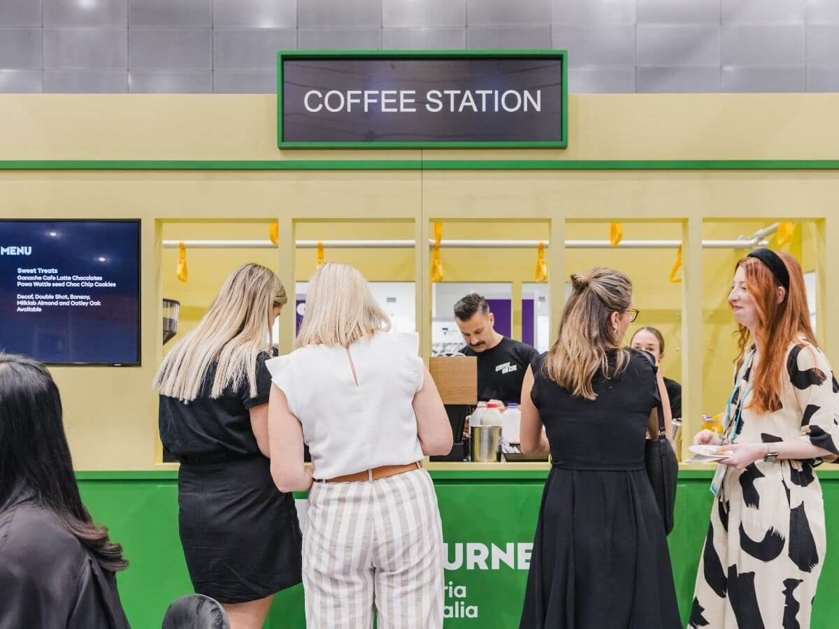 Attendees receiving their coffees