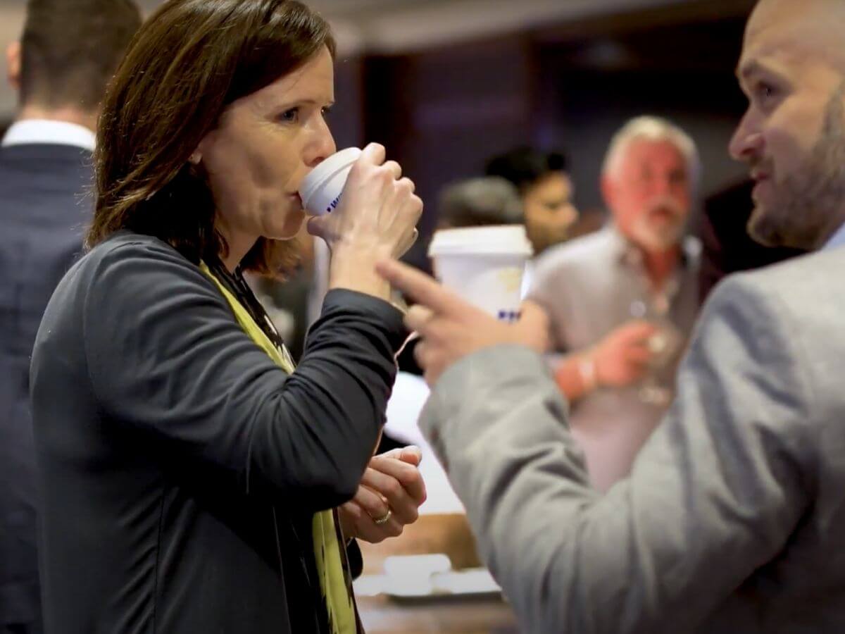 Conference delegates drinking coffee during break