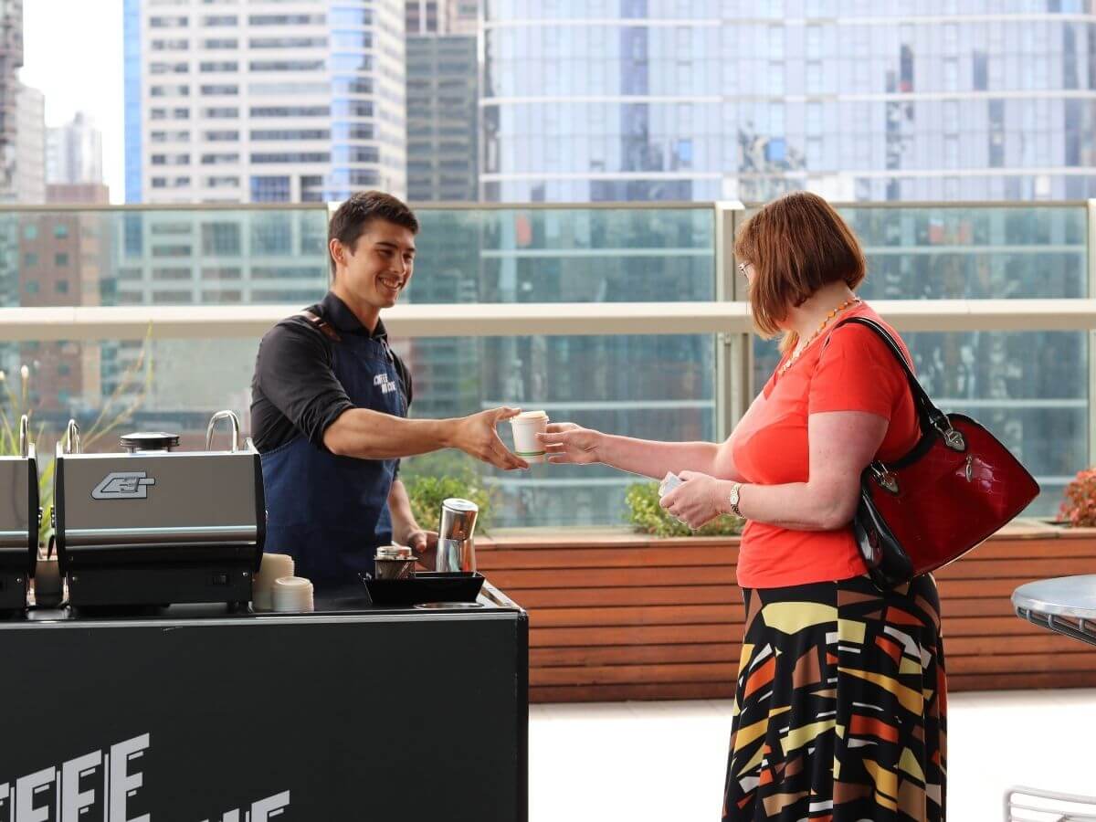 Barista making coffee in corporate office