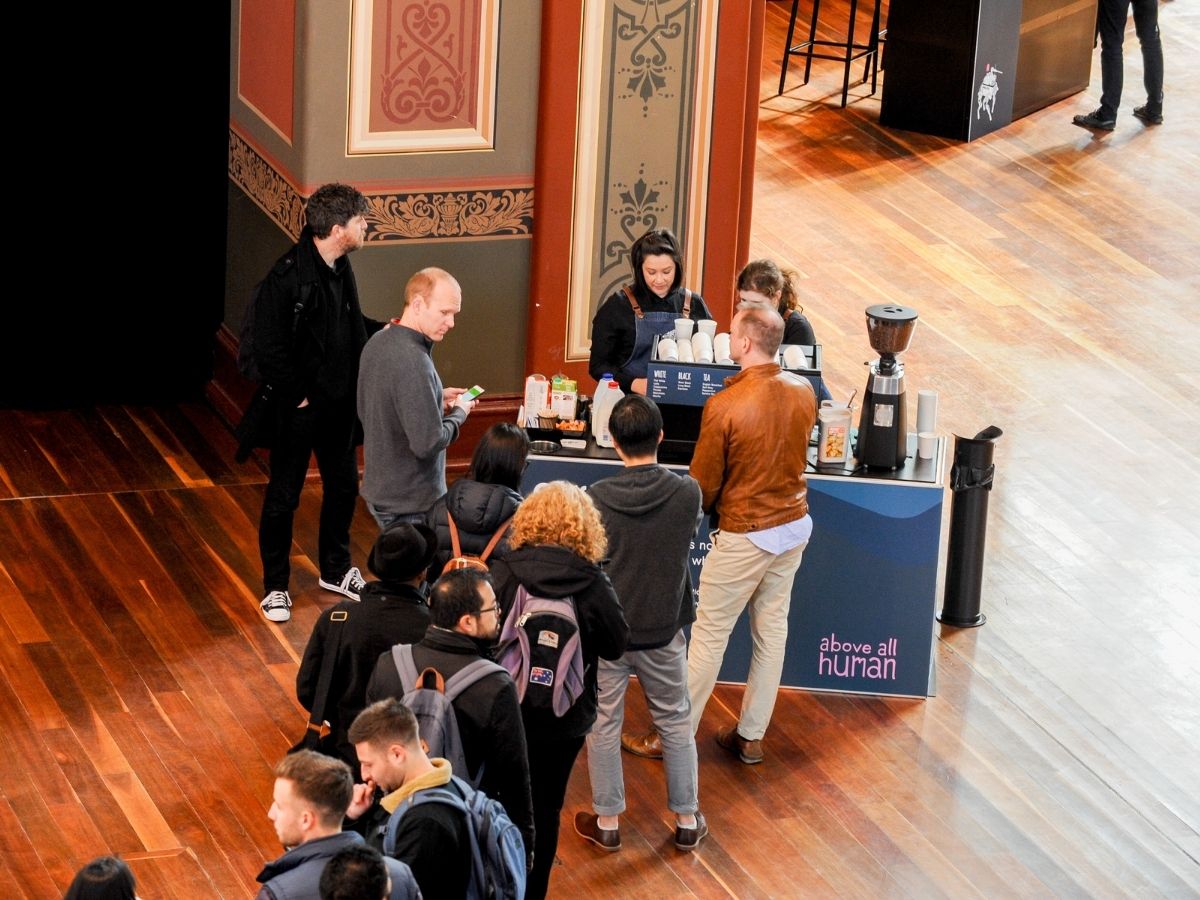 Conference delegates queuing at the coffee cart