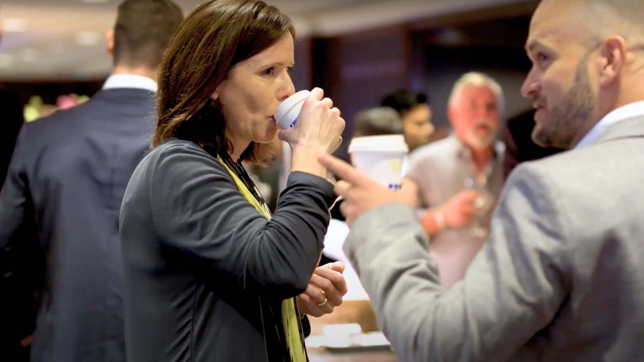 Conference delegates drinking coffee