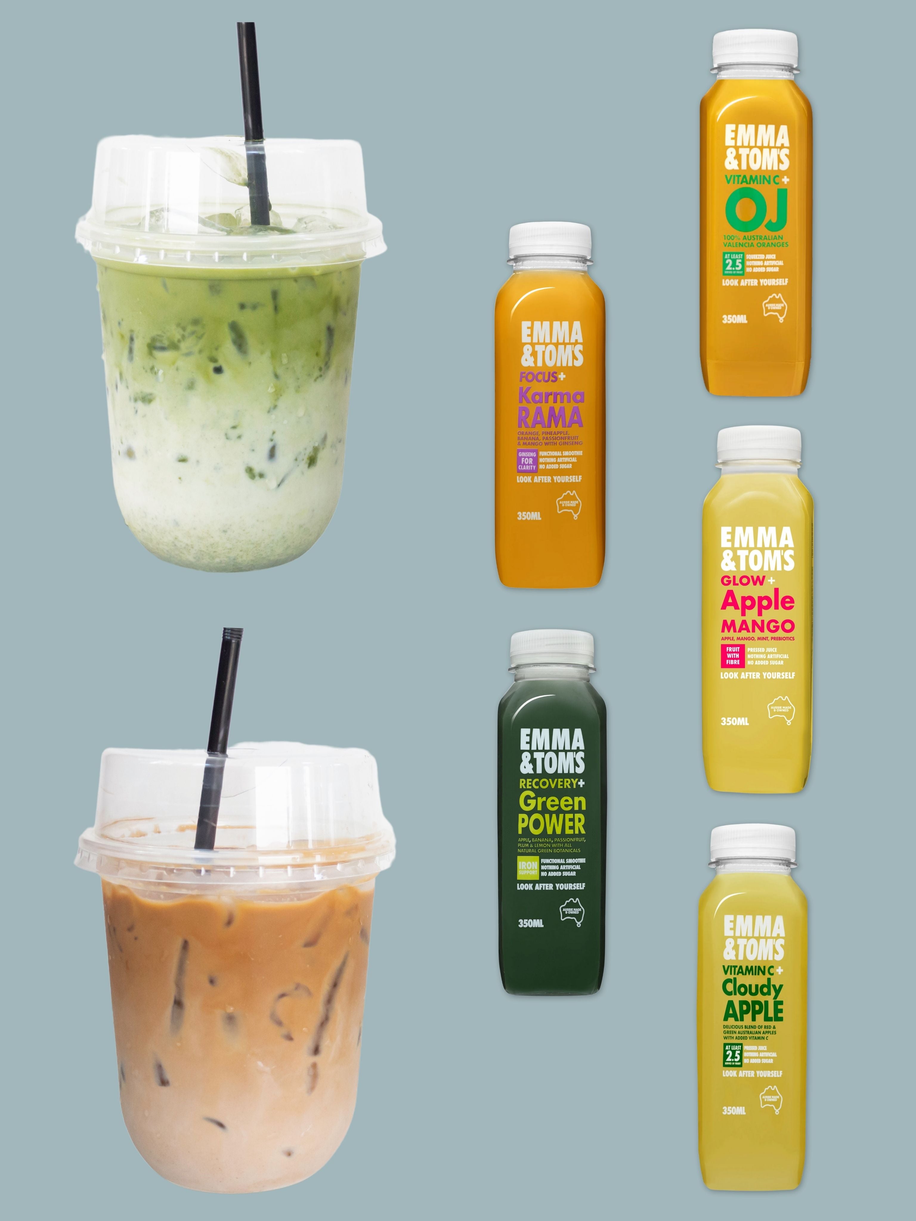 Two iced drinks with straws and six fresh juice bottles