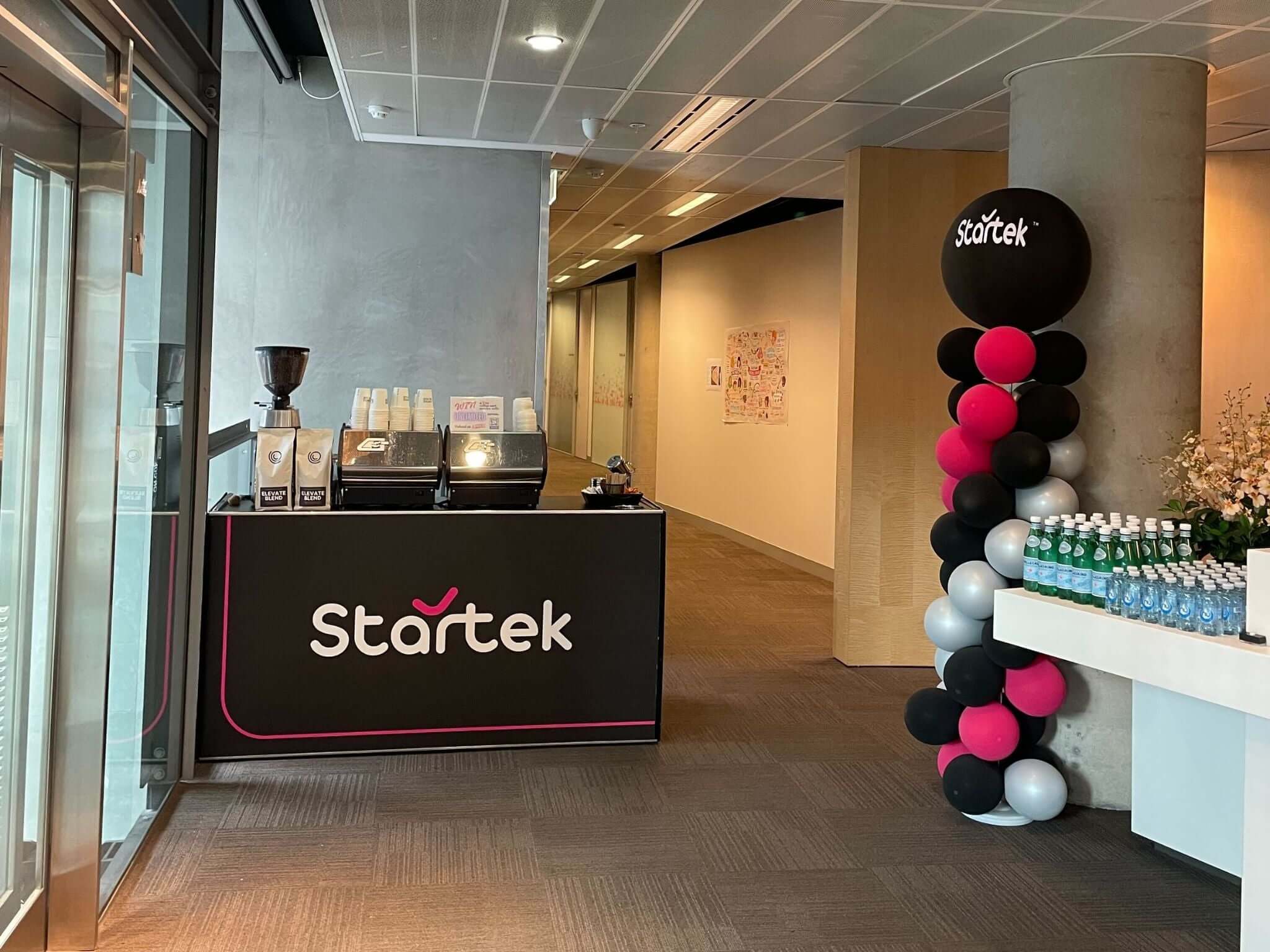 Startek branded coffee cart inside of workplace