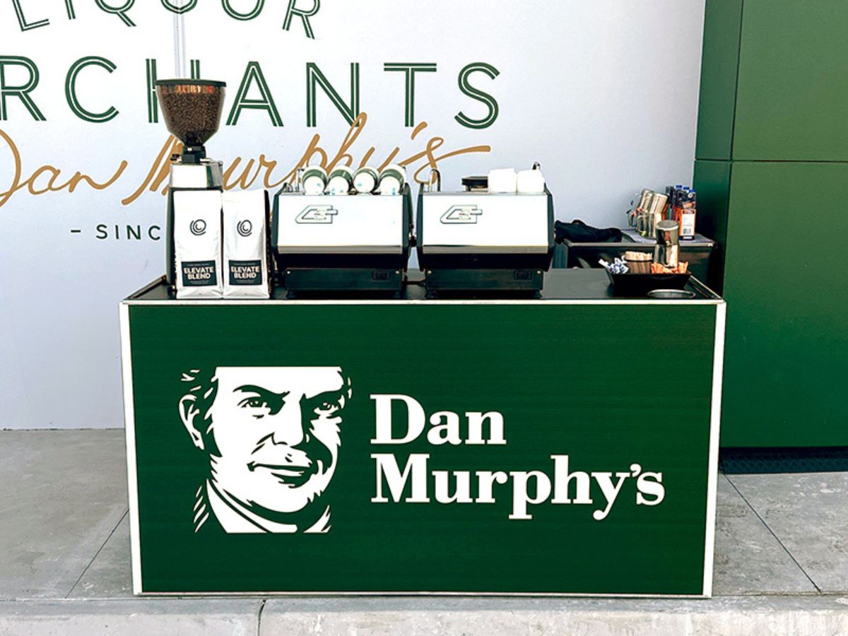 Custom front panel branded coffee cart at retail activation event