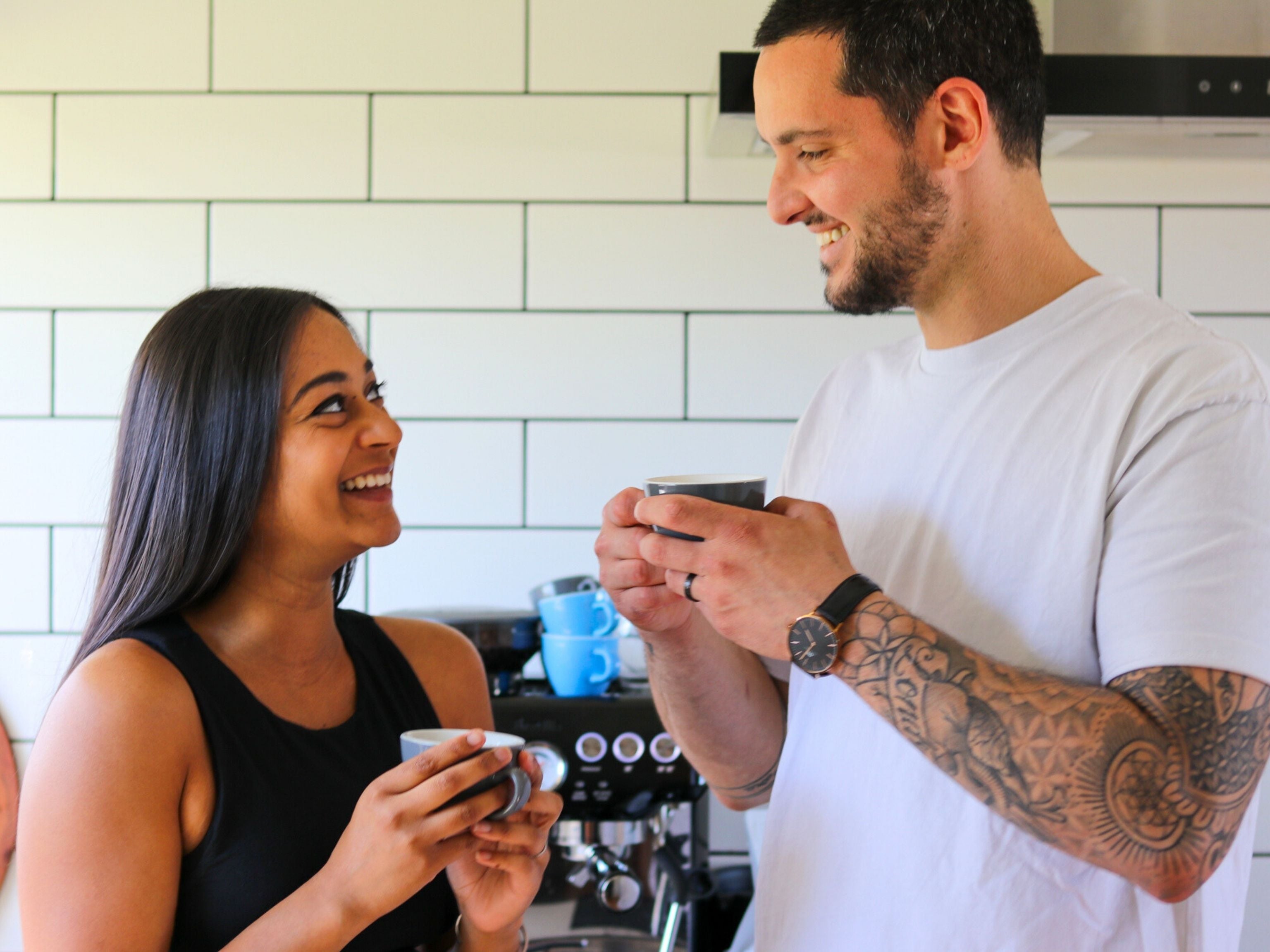 Couple enjoying their coffee at home