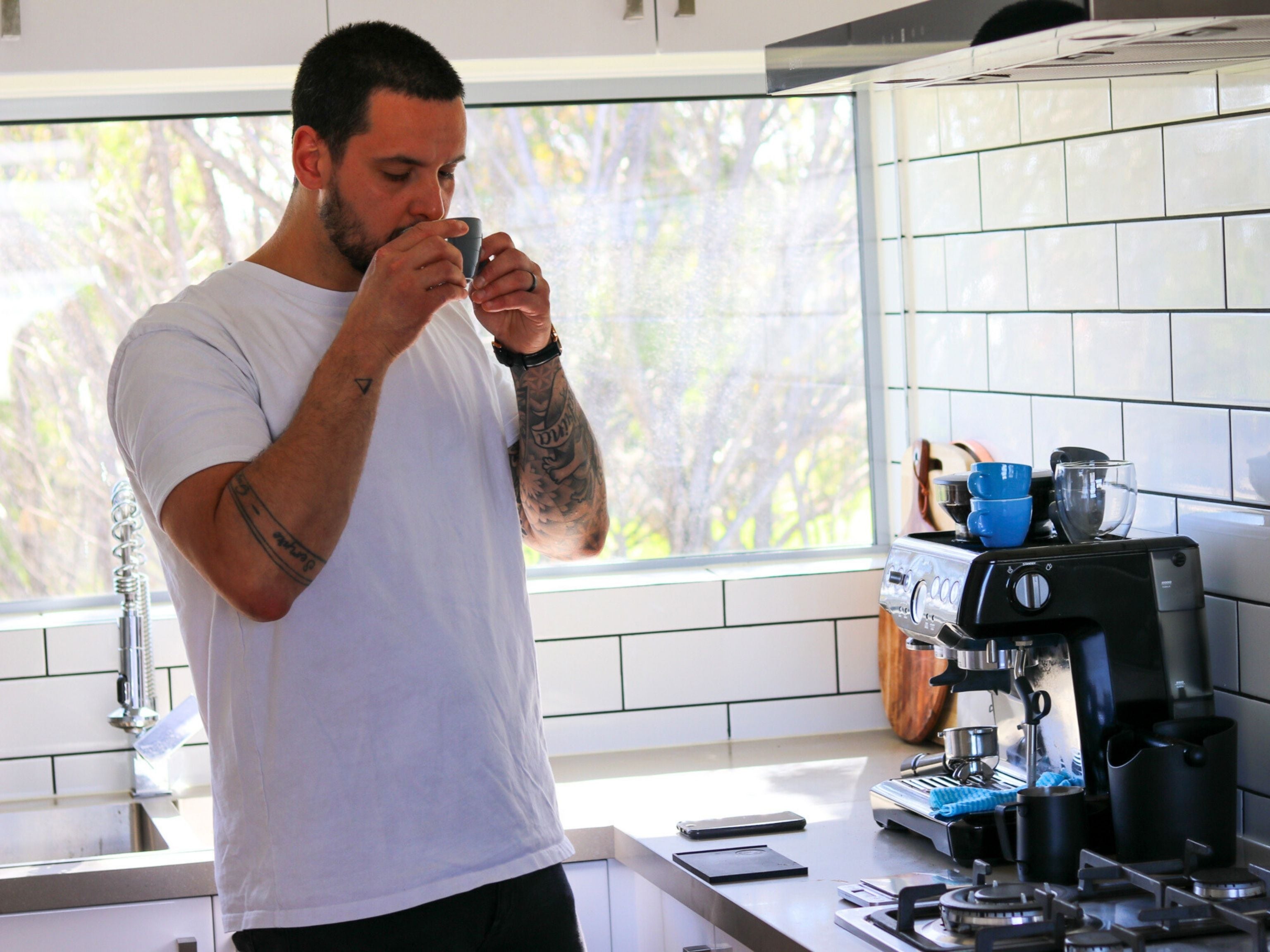 Man drinking coffee at home