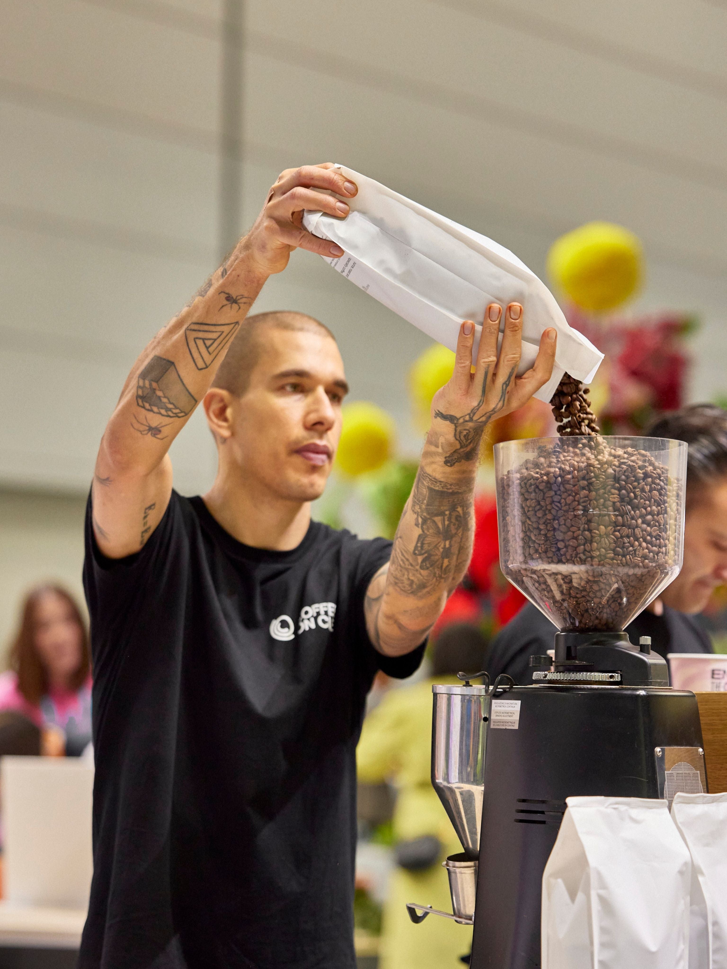 Joey Krosch topping up grinder hopper