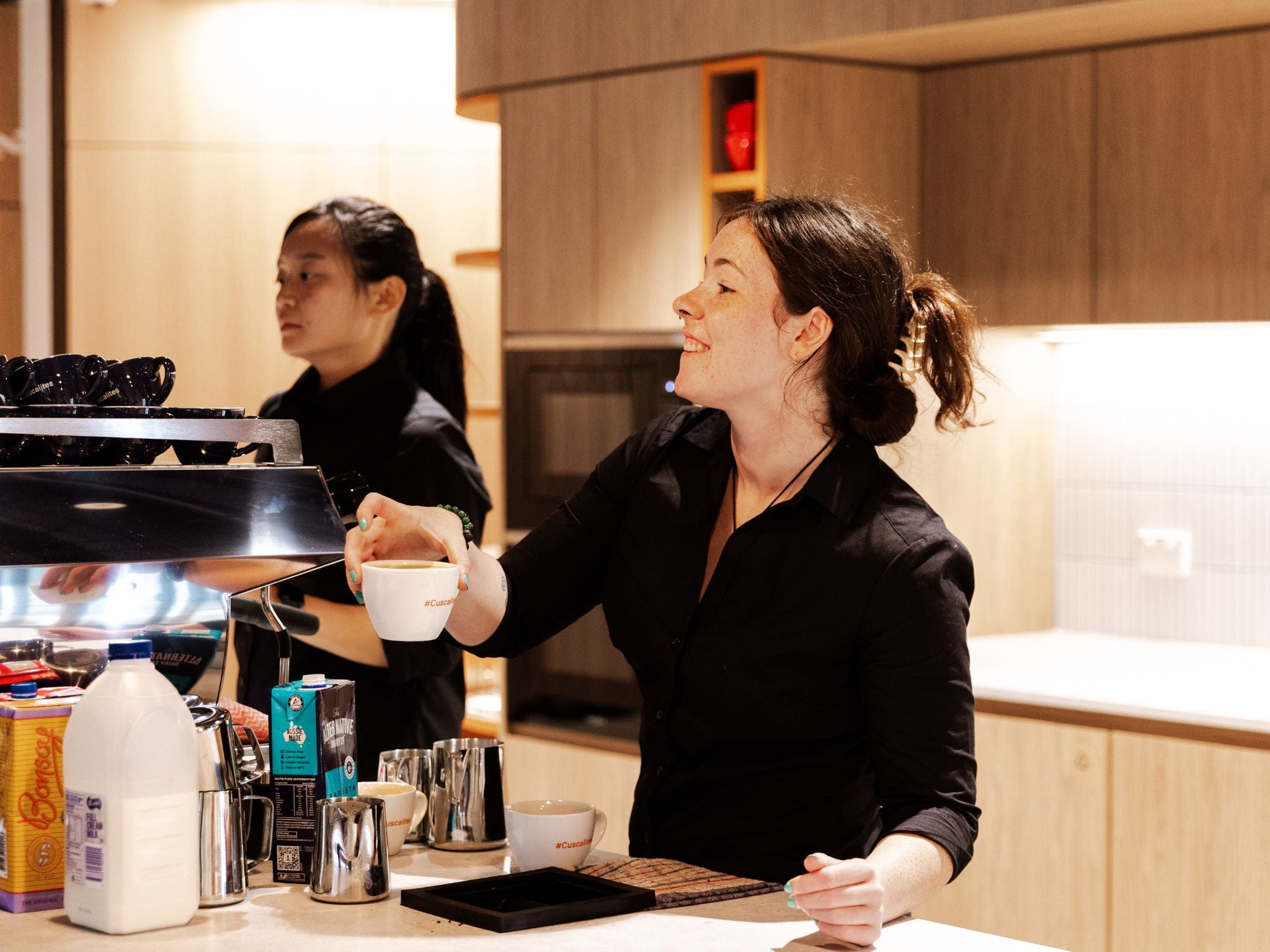 Workplace barista serving coffee to Cuscal staff