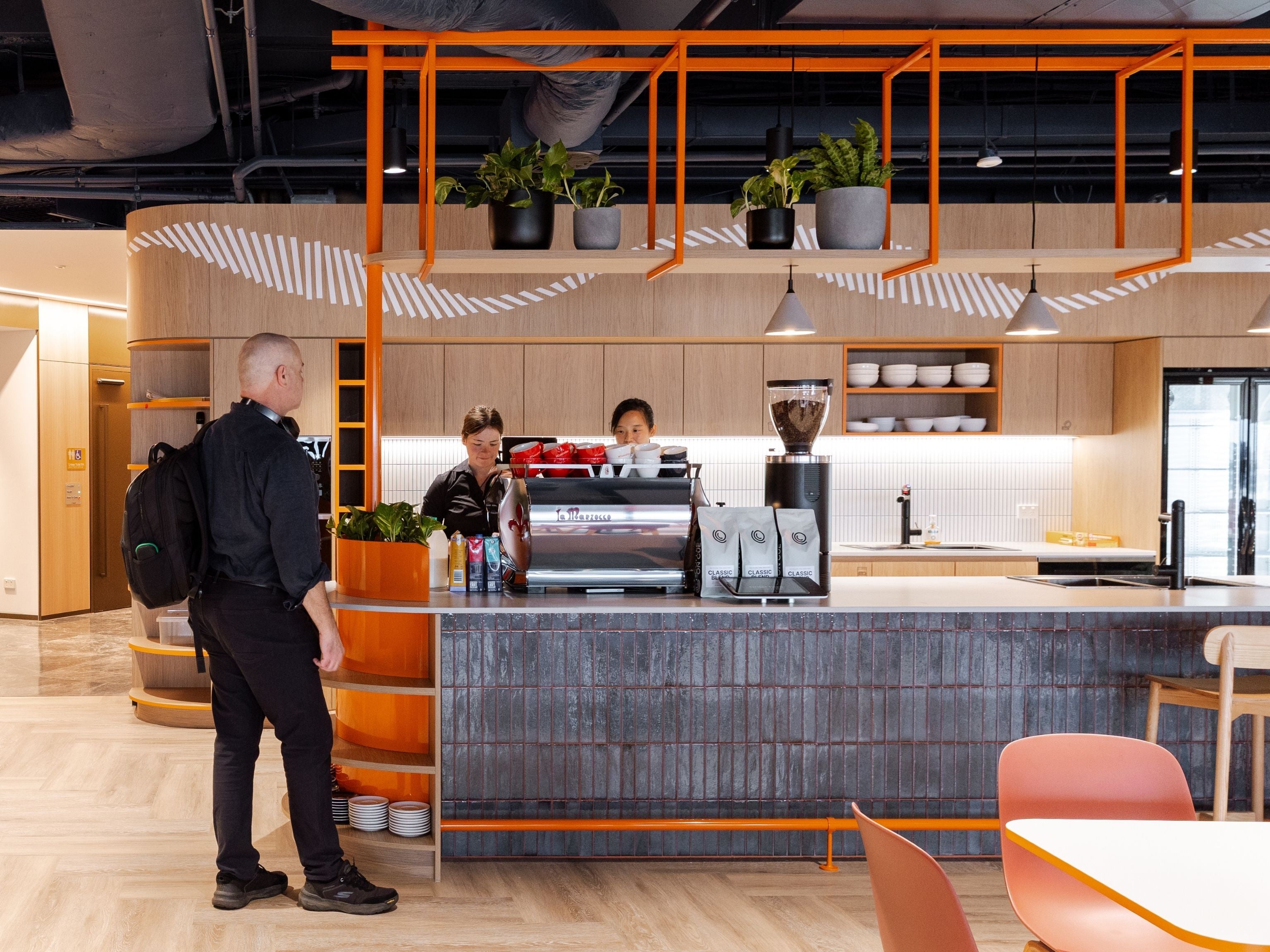 Cuscal team member waiting to collect coffee at in-house cafe